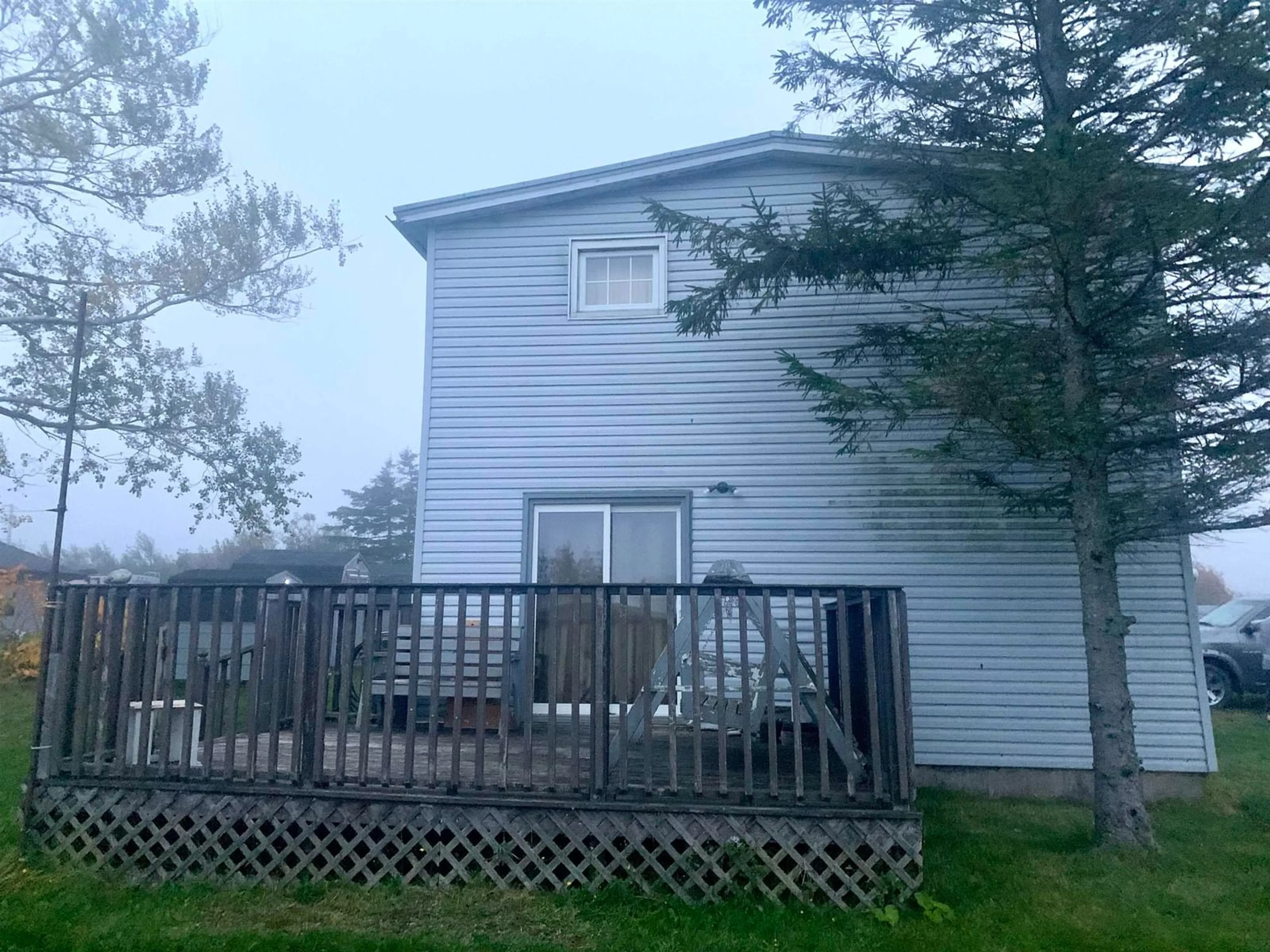 Frontside or backside of a home, the fenced backyard for 29 Boyd St, Glace Bay Nova Scotia B1A 2G5