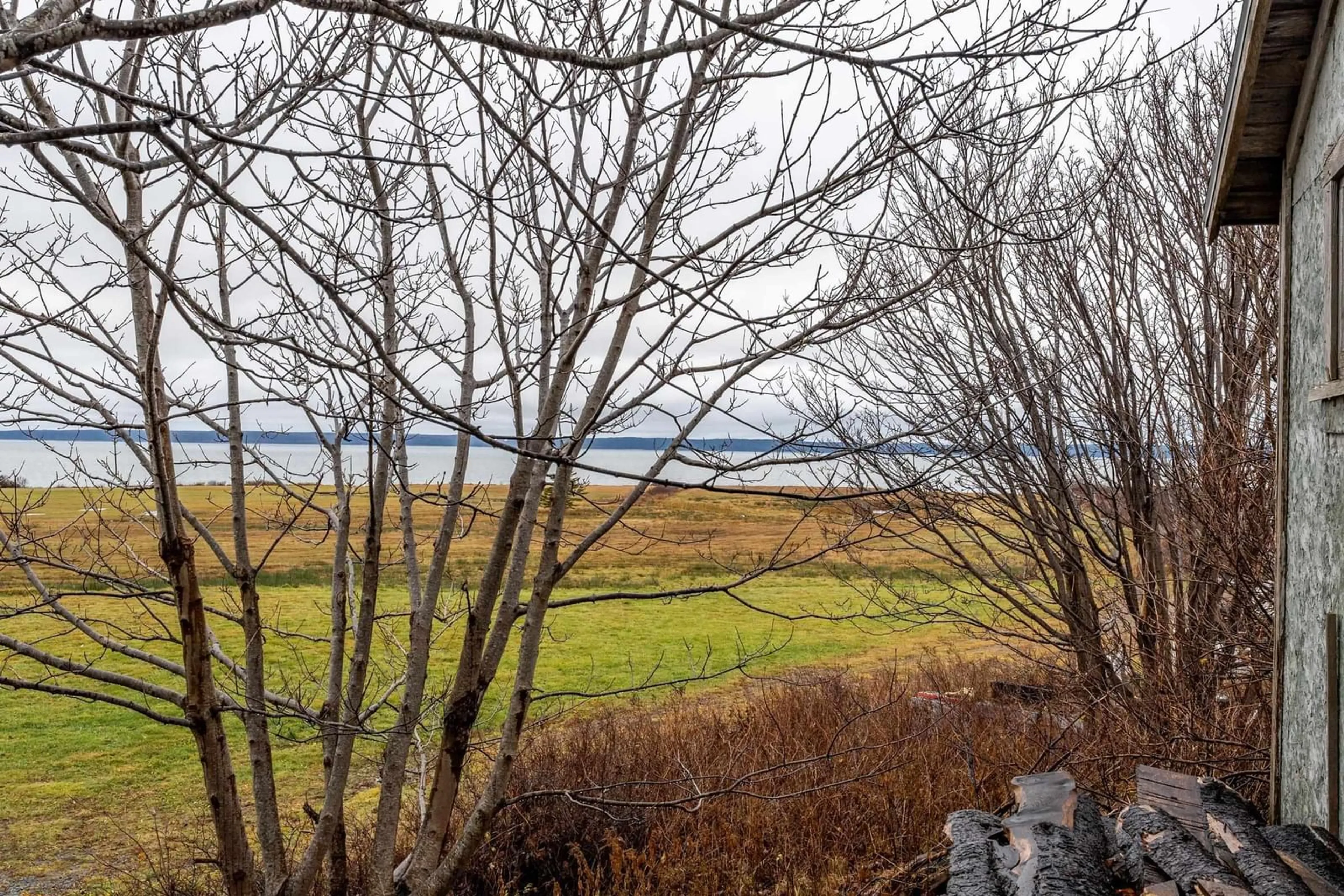 A pic from exterior of the house or condo, the fenced backyard for 3353 Highway 1, Belliveaus Cove Nova Scotia B0W 1J0