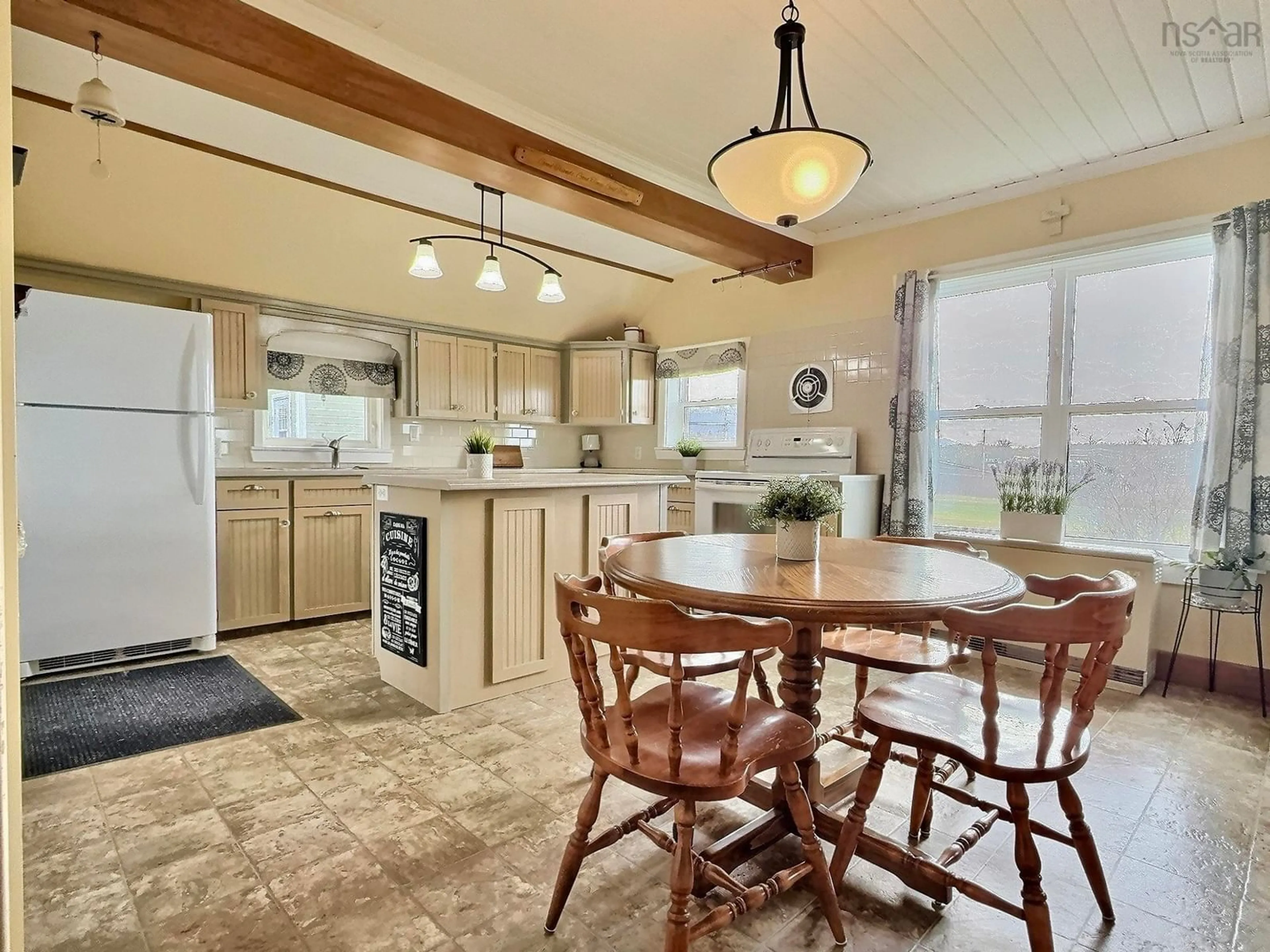 Open concept kitchen for 14072 Cabot Trail Rd, Point Cross Nova Scotia B0H 1H0