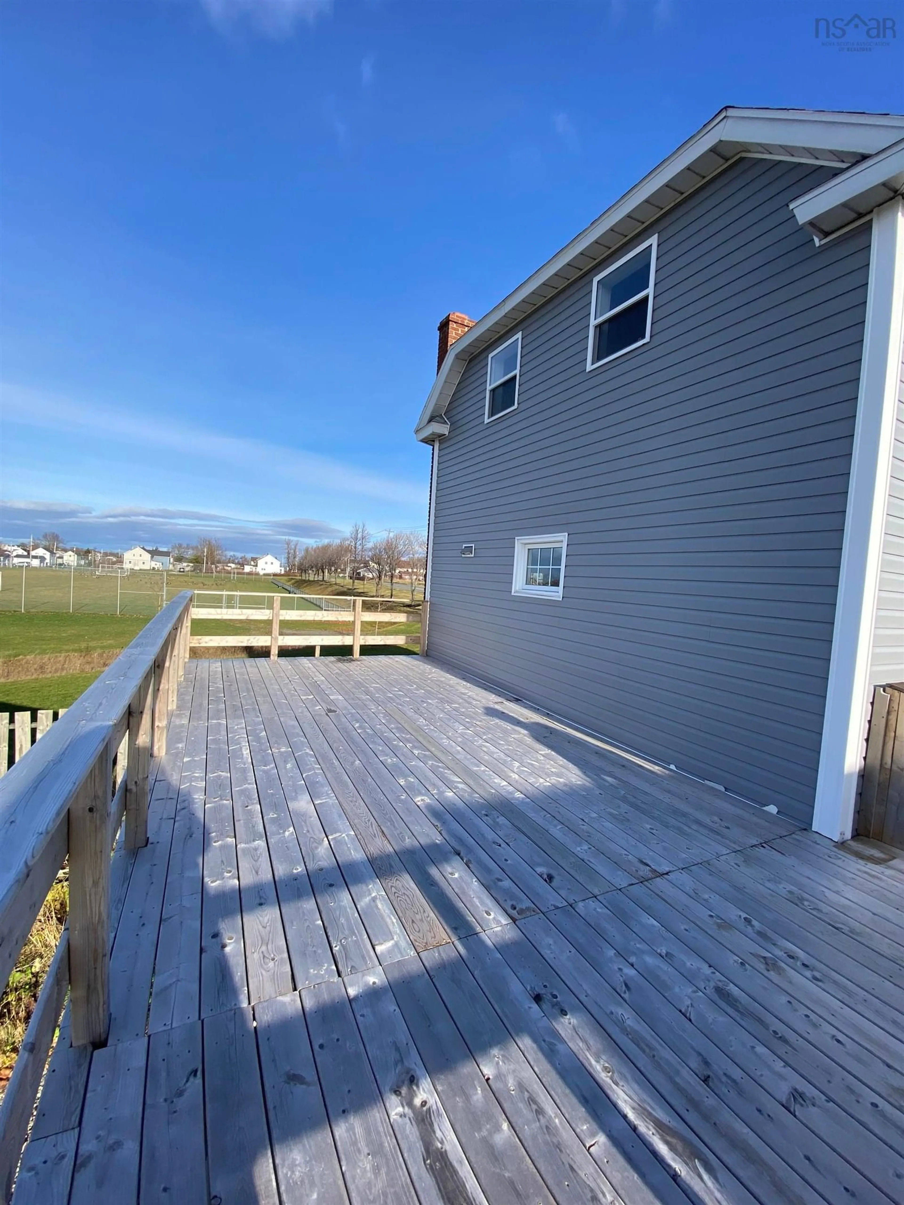 A pic from exterior of the house or condo, the fenced backyard for 583 Heelan St, New Waterford Nova Scotia B1H 3C6