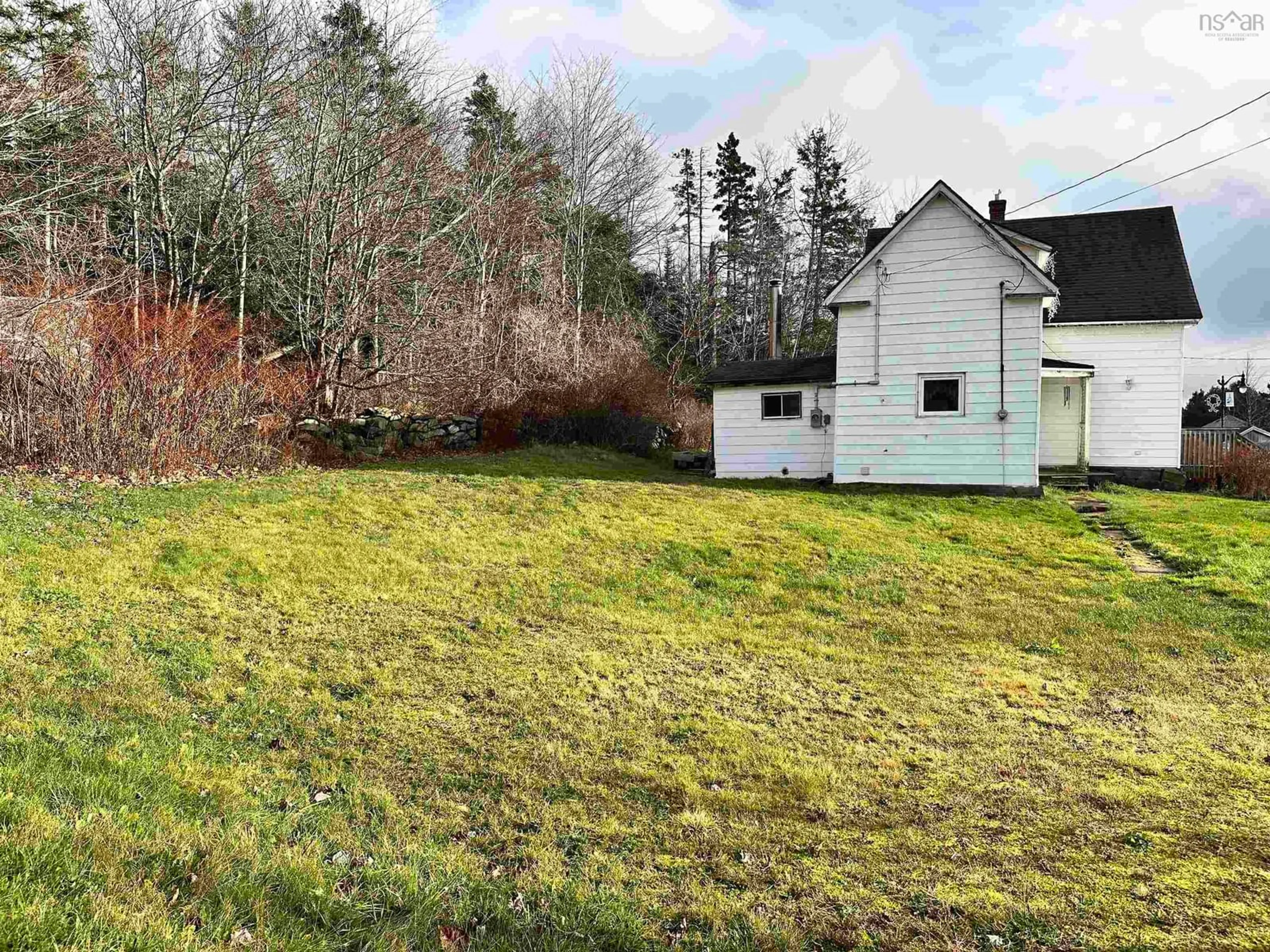 Frontside or backside of a home, the fenced backyard for 6 Lake Rd, Sheet Harbour Nova Scotia B0J 3B0