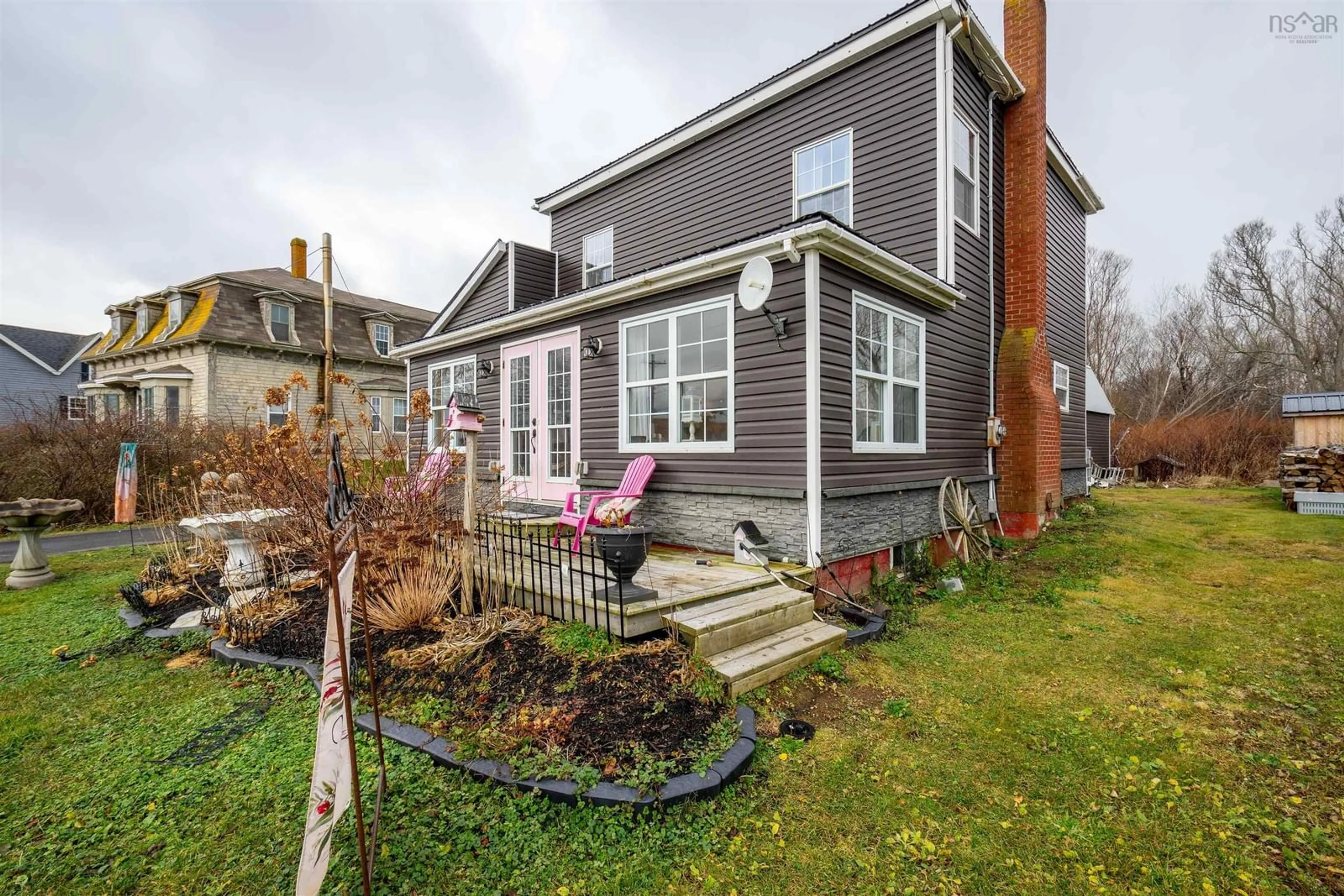 A pic from exterior of the house or condo, the fenced backyard for 121 Water St, Westport Nova Scotia B0V 1H0