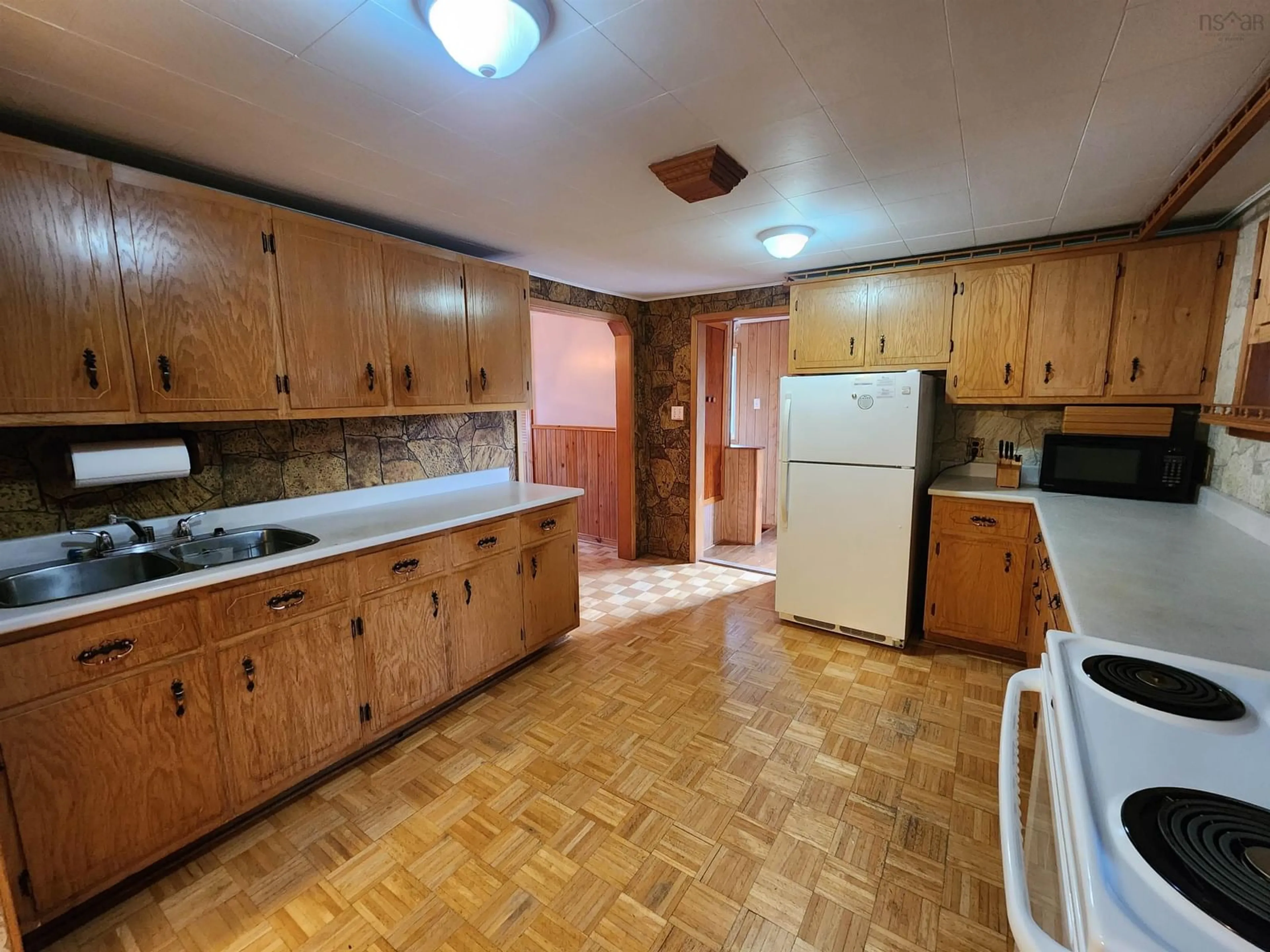 Kitchen, wood floors, cottage for 27 Cook St, Canso Nova Scotia B0H 1H0