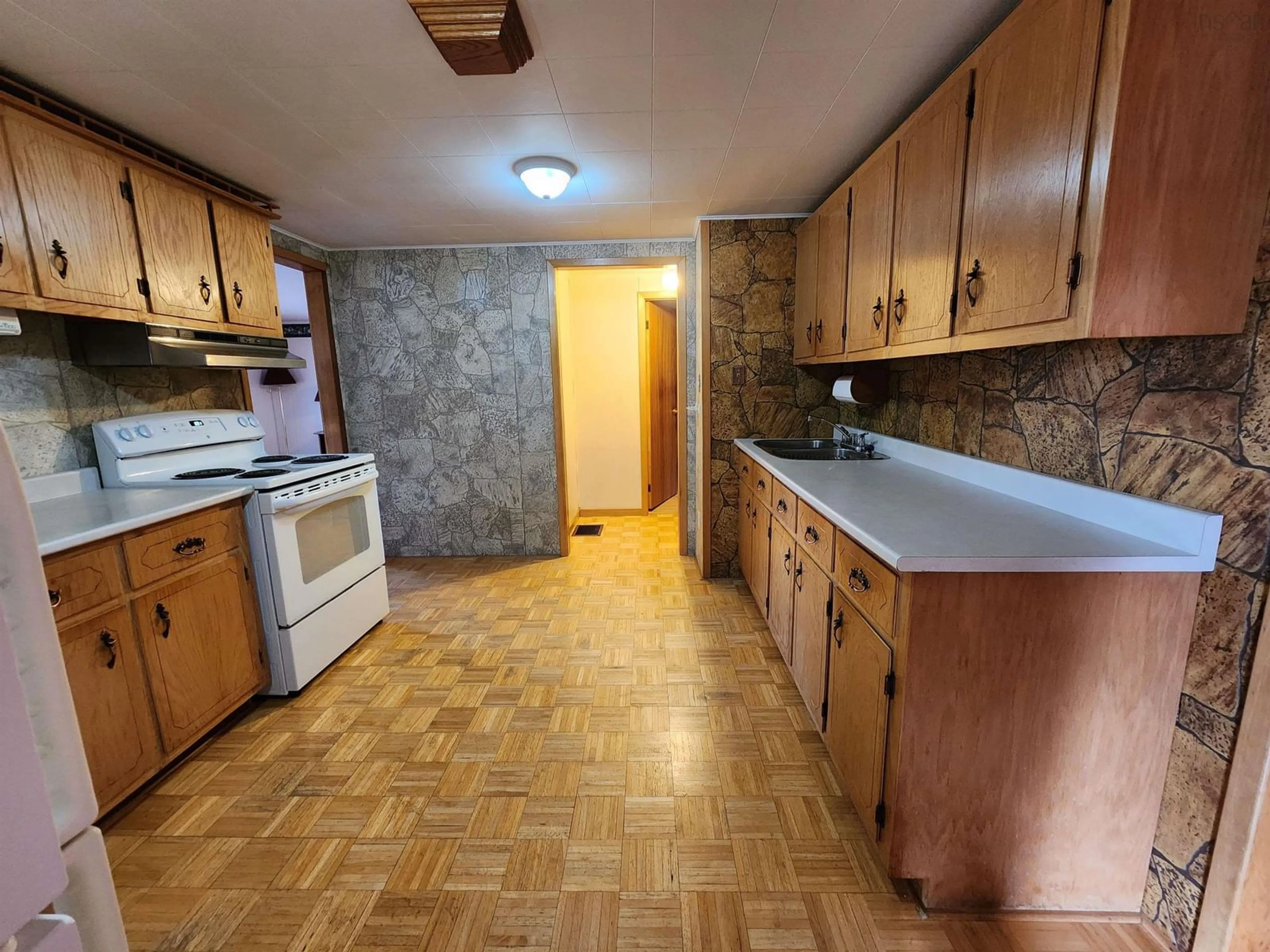 Standard kitchen, wood floors, cottage for 27 Cook St, Canso Nova Scotia B0H 1H0