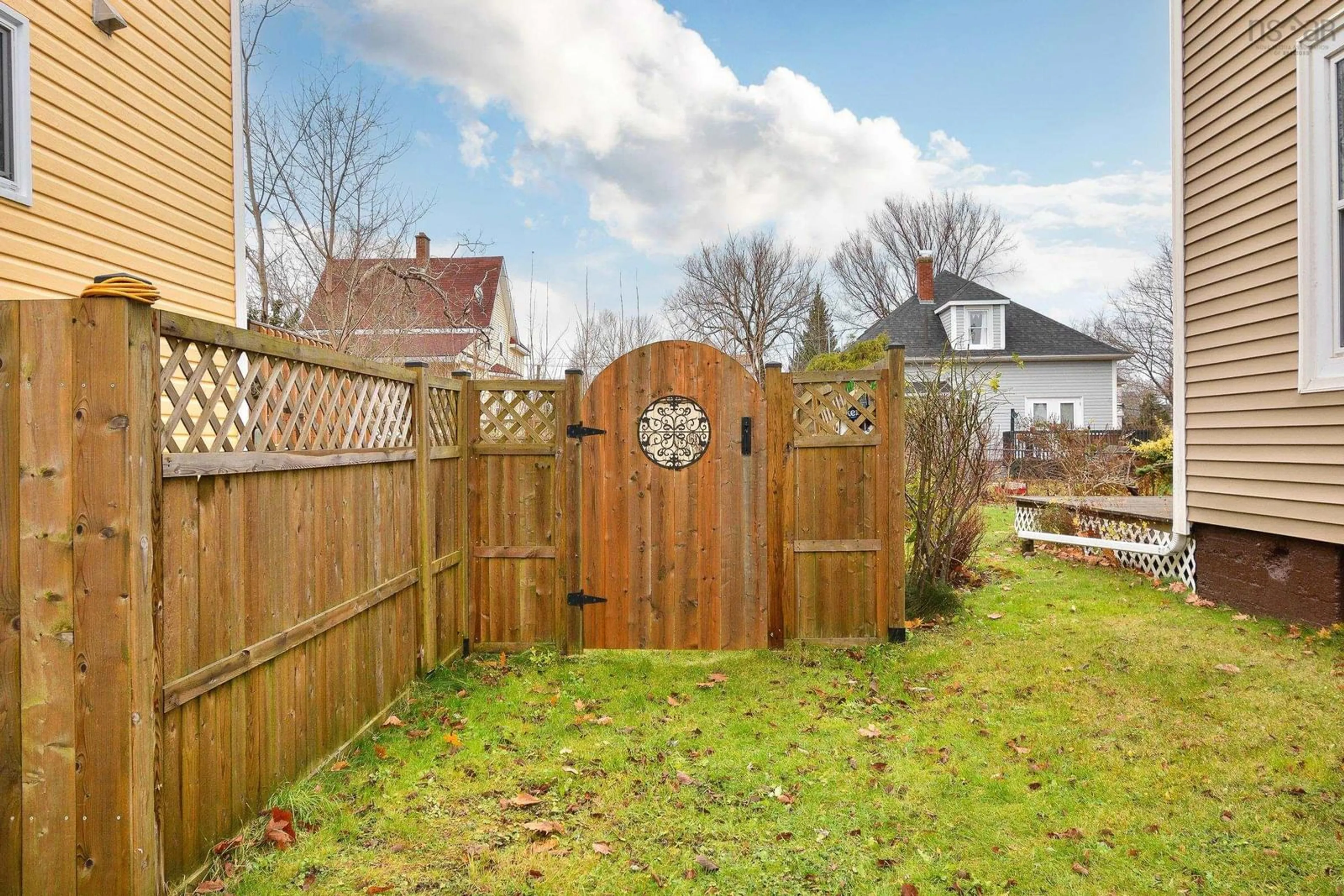 Patio, the fenced backyard for 59 Milton St, Sydney Nova Scotia B1P 4L9