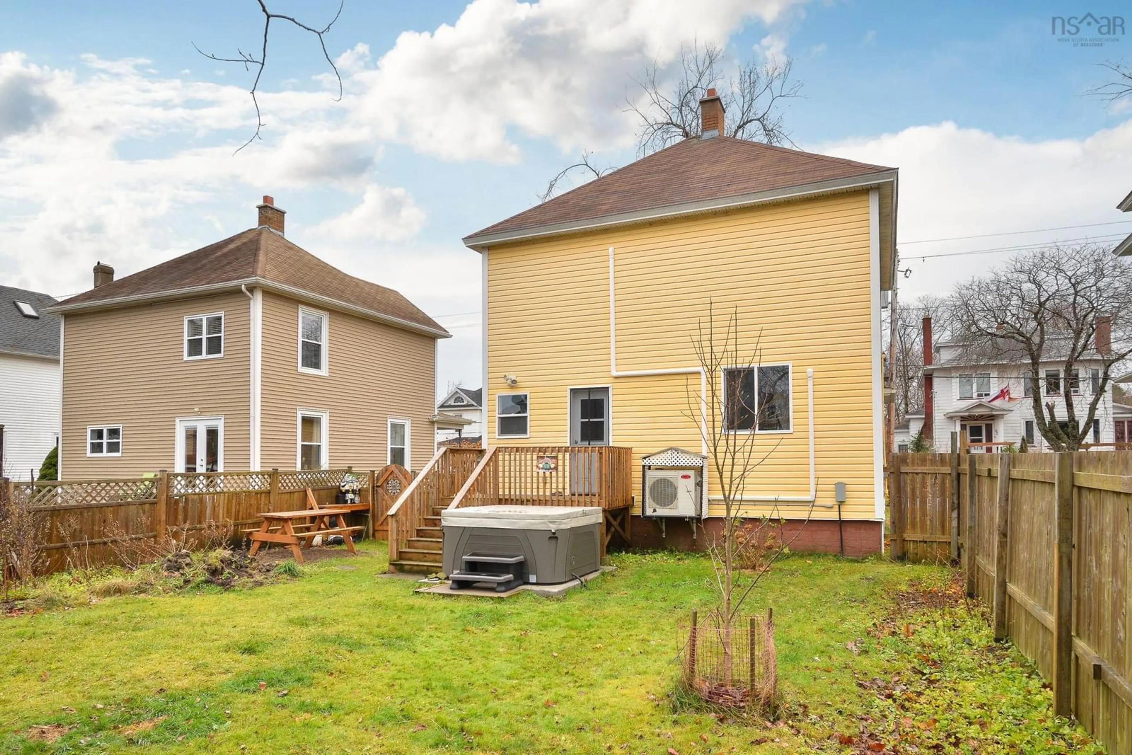 Frontside or backside of a home, the fenced backyard for 59 Milton St, Sydney Nova Scotia B1P 4L9