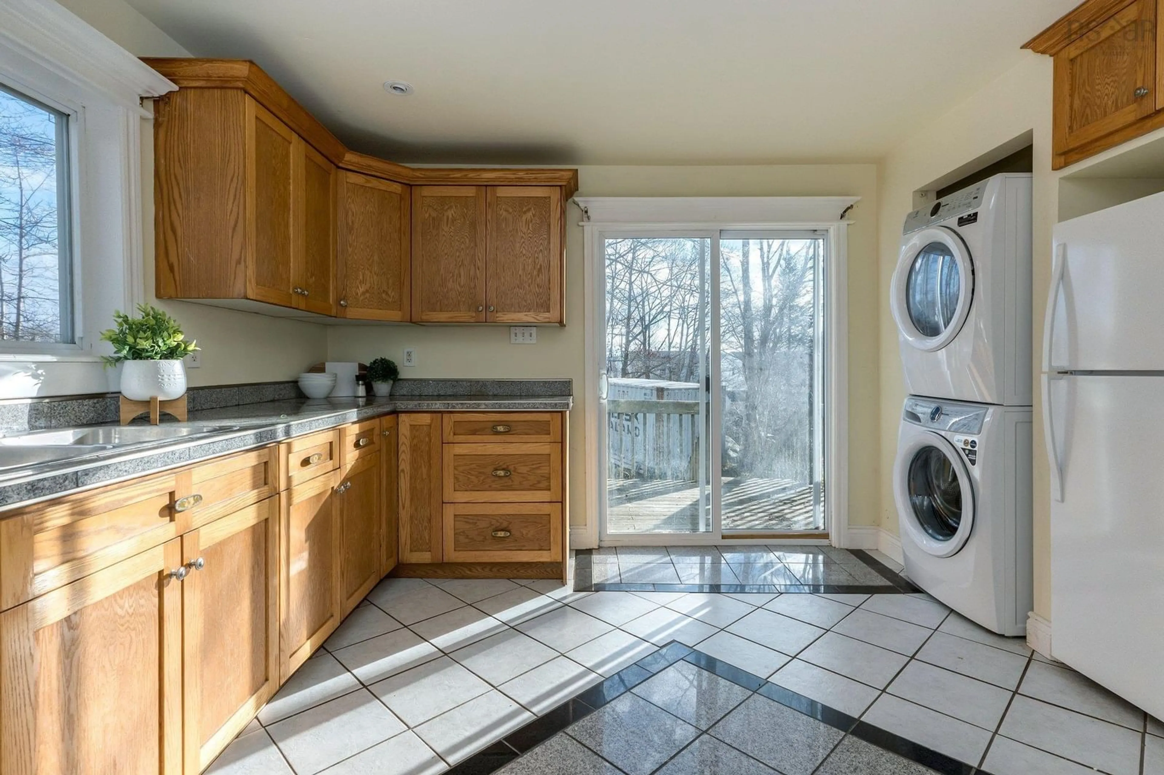 Kitchen with laundary machines, wood floors for 18 Layton Rd, Spryfield Nova Scotia B3P 1Z8