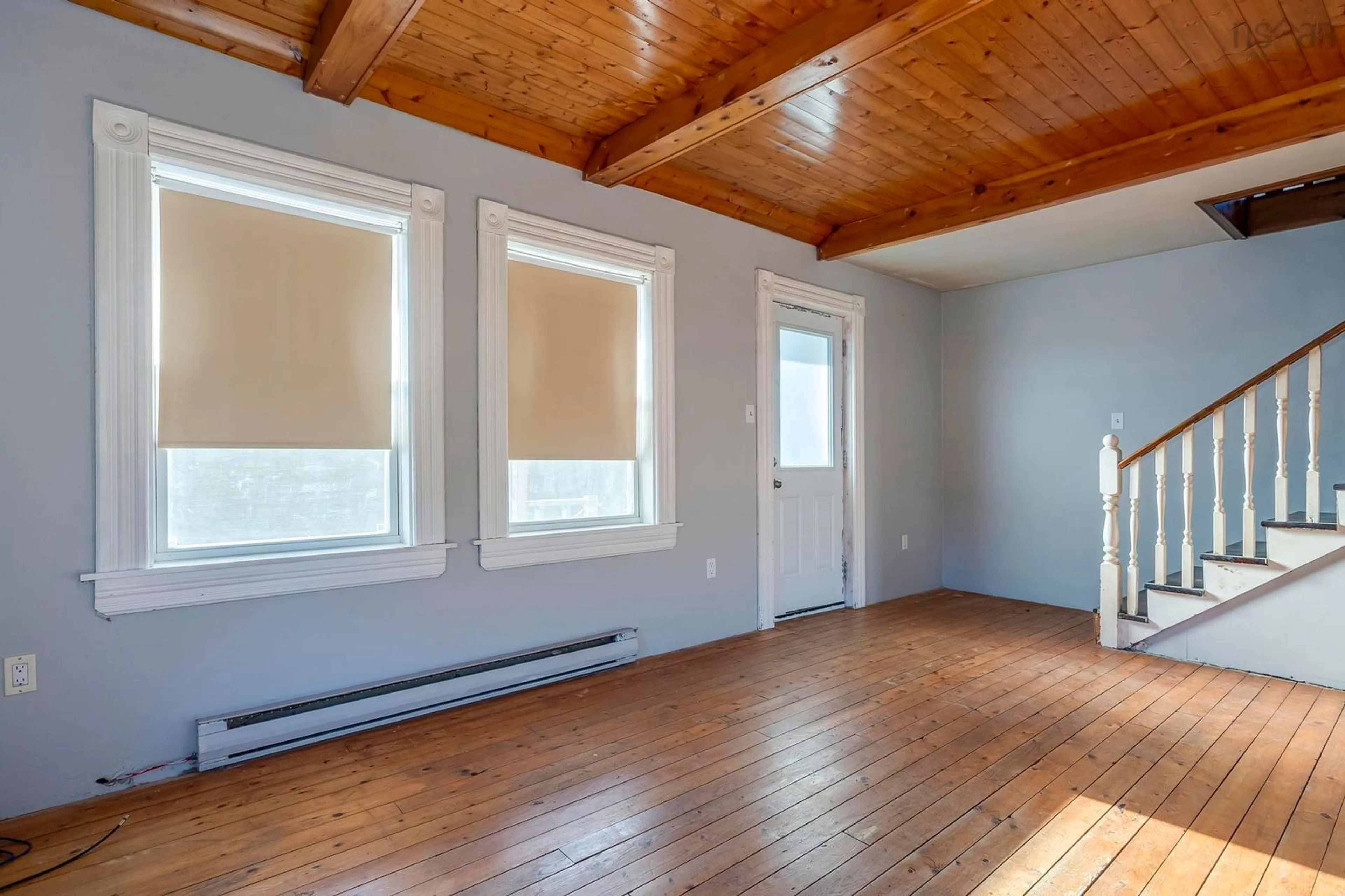 A pic of a room, wood floors for 24179 Highway 7, Sheet Harbour Nova Scotia B0J 3B0