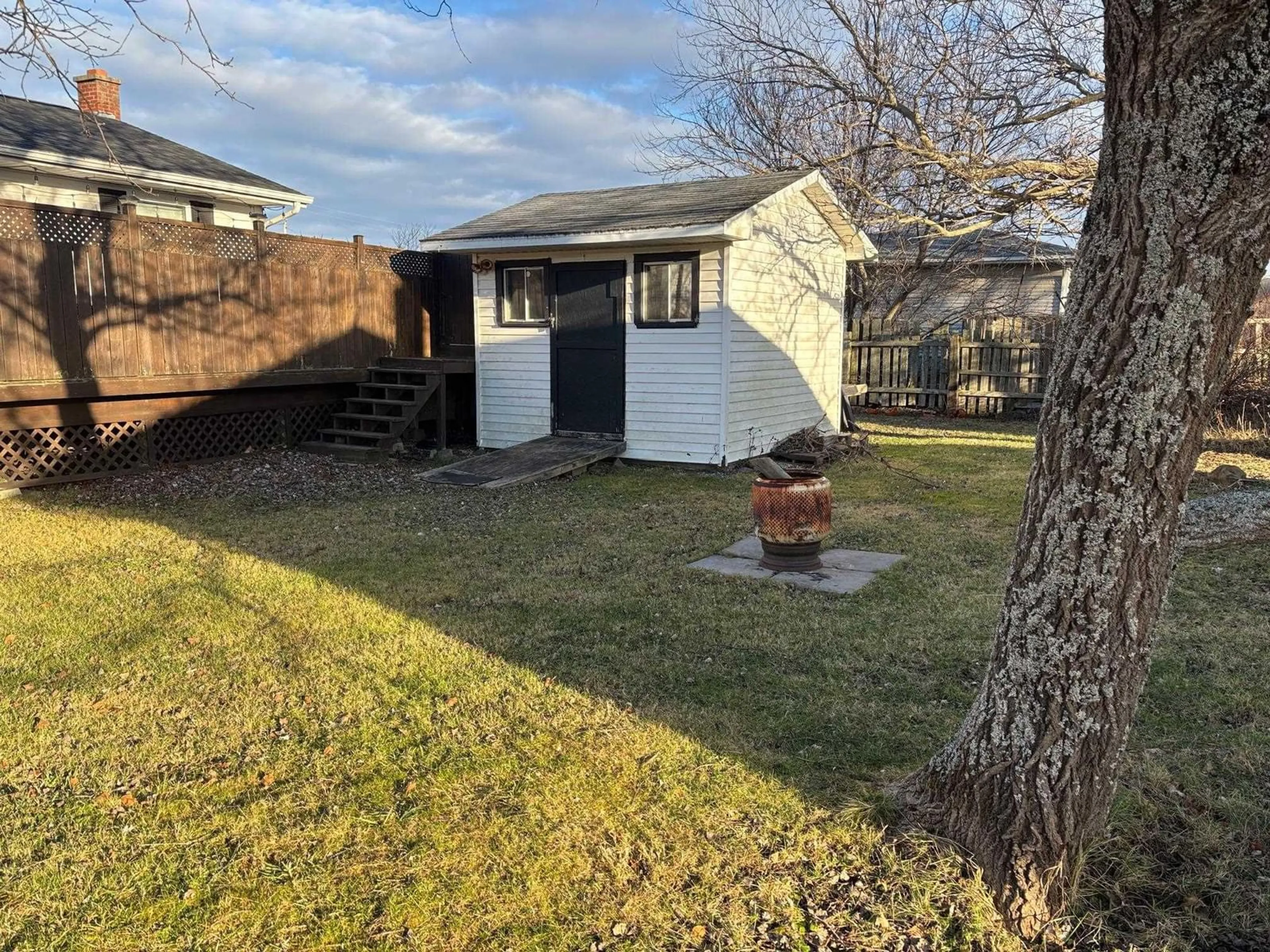 Frontside or backside of a home, the fenced backyard for 454 Gerrard St, New Waterford Nova Scotia B1H 4J1