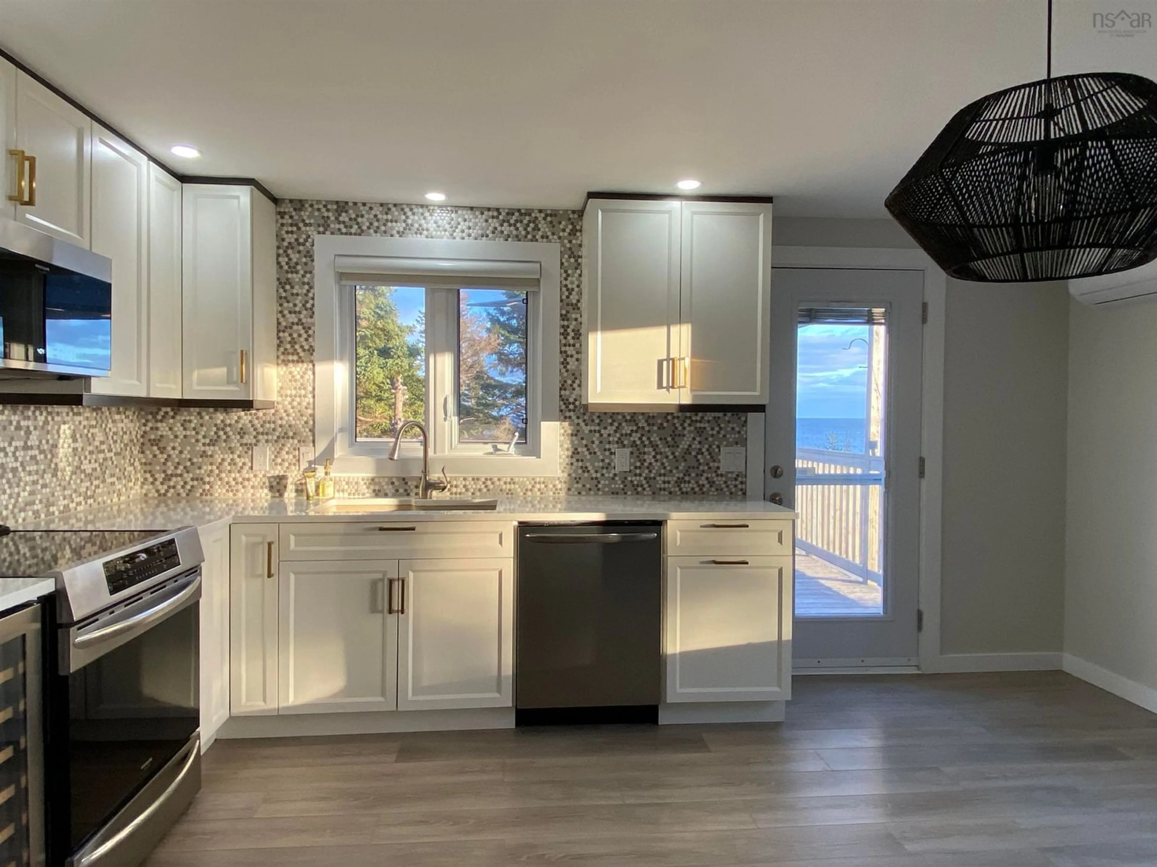 Open concept kitchen for 76 Edgewater Dr, White Point Nova Scotia B0T 1G0