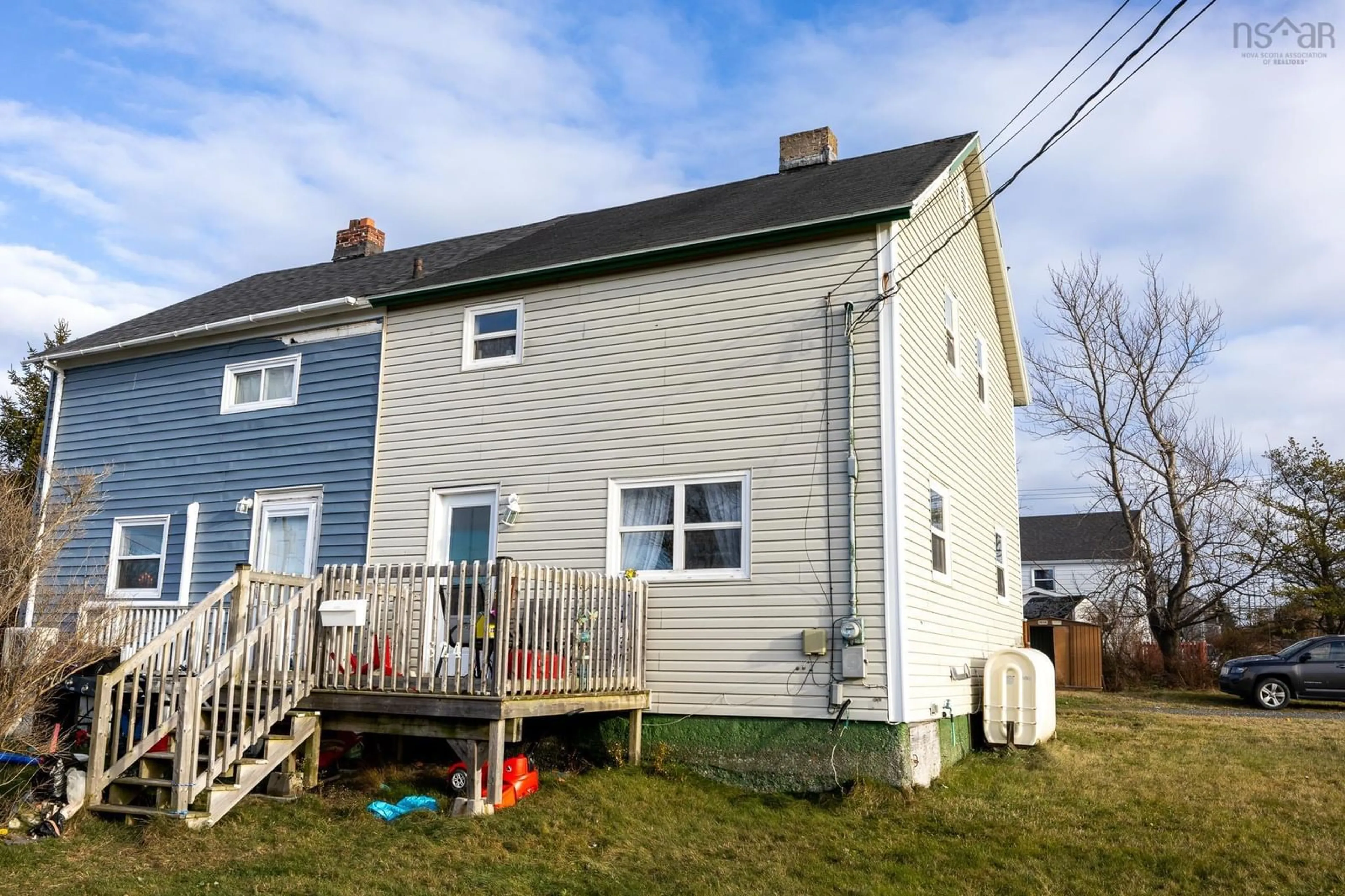 Frontside or backside of a home, the fenced backyard for 524 Second Street, New Waterford Nova Scotia B1H 3A6