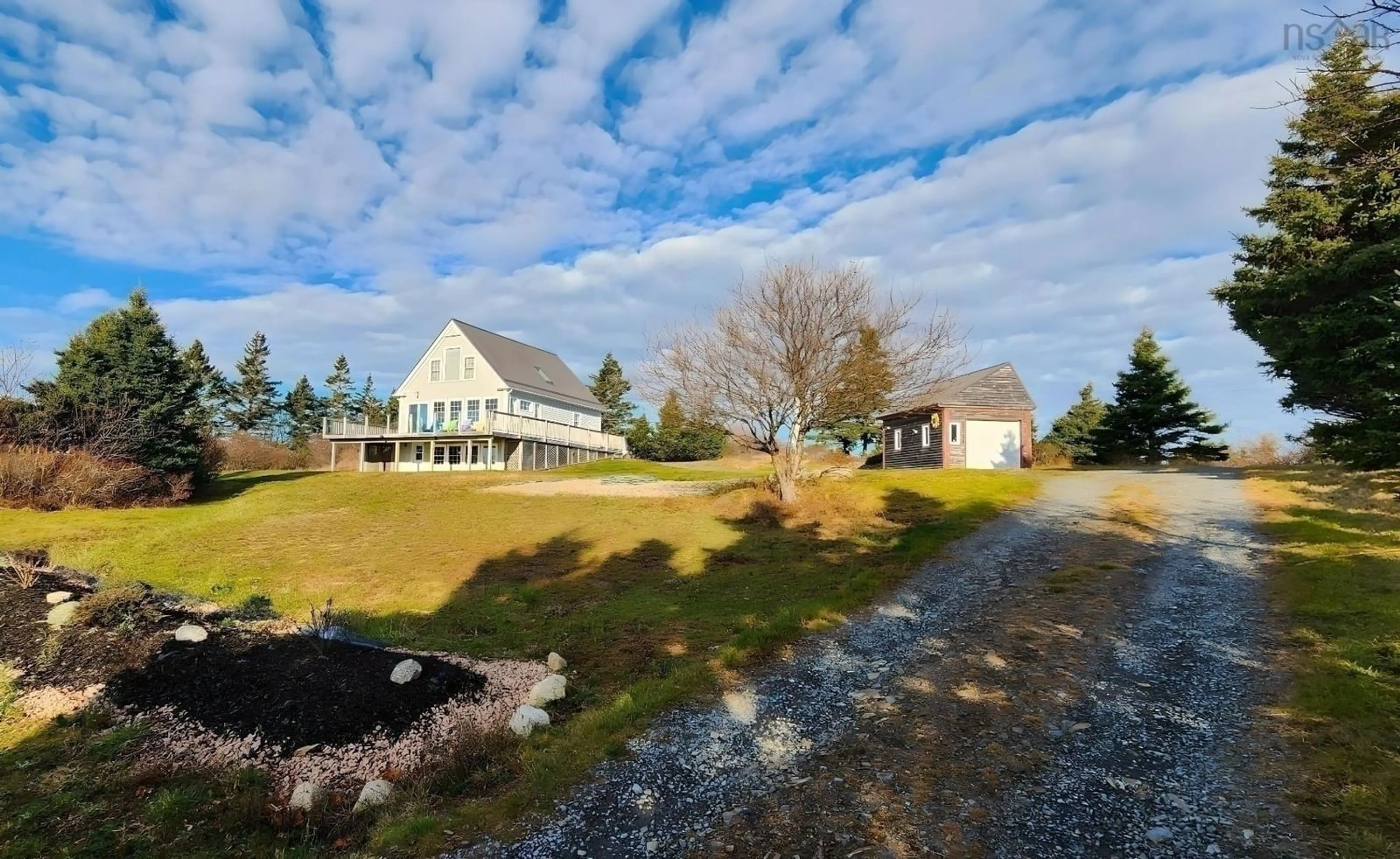 A pic from exterior of the house or condo, the fenced backyard for 157 The Point Rd, Blue Rocks Nova Scotia B0J 2C0