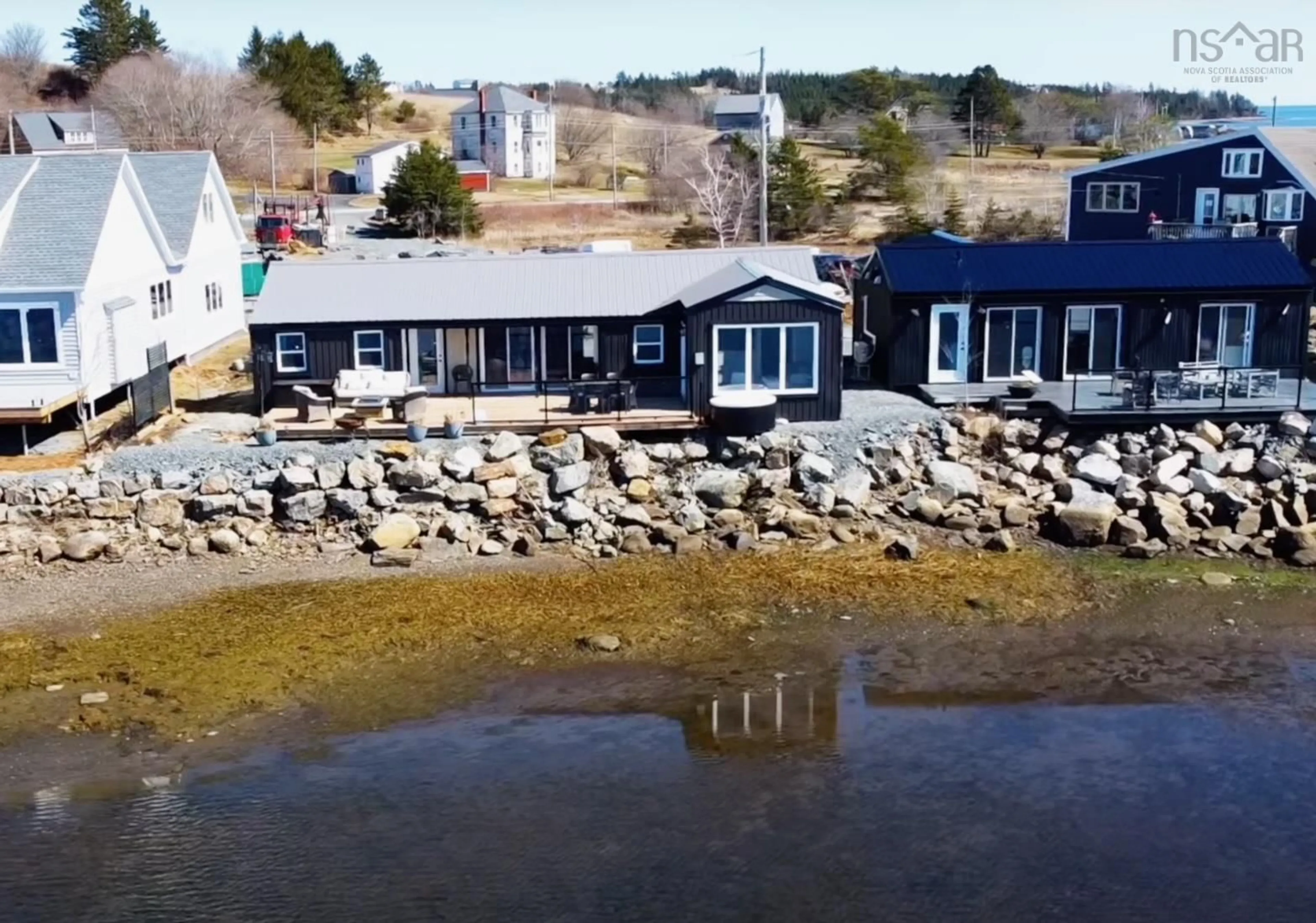 A pic from outside/outdoor area/front of a property/back of a property/a pic from drone, water/lake/river/ocean view for 693 Masons Beach Rd #Unit 7, First South Nova Scotia B0J 2C0