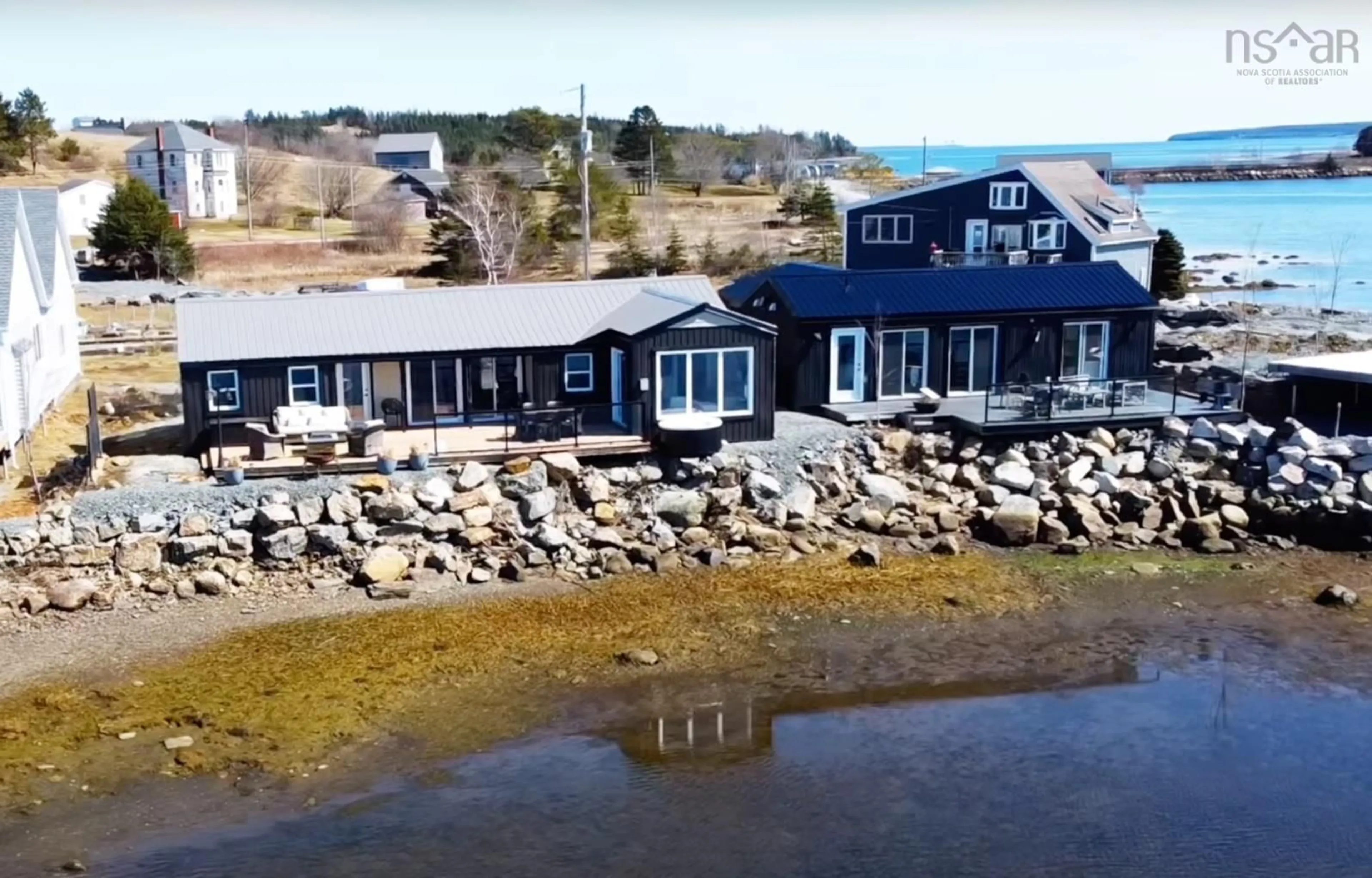 A pic from outside/outdoor area/front of a property/back of a property/a pic from drone, water/lake/river/ocean view for 693 Masons Beach Rd #Unit 7, First South Nova Scotia B0J 2C0