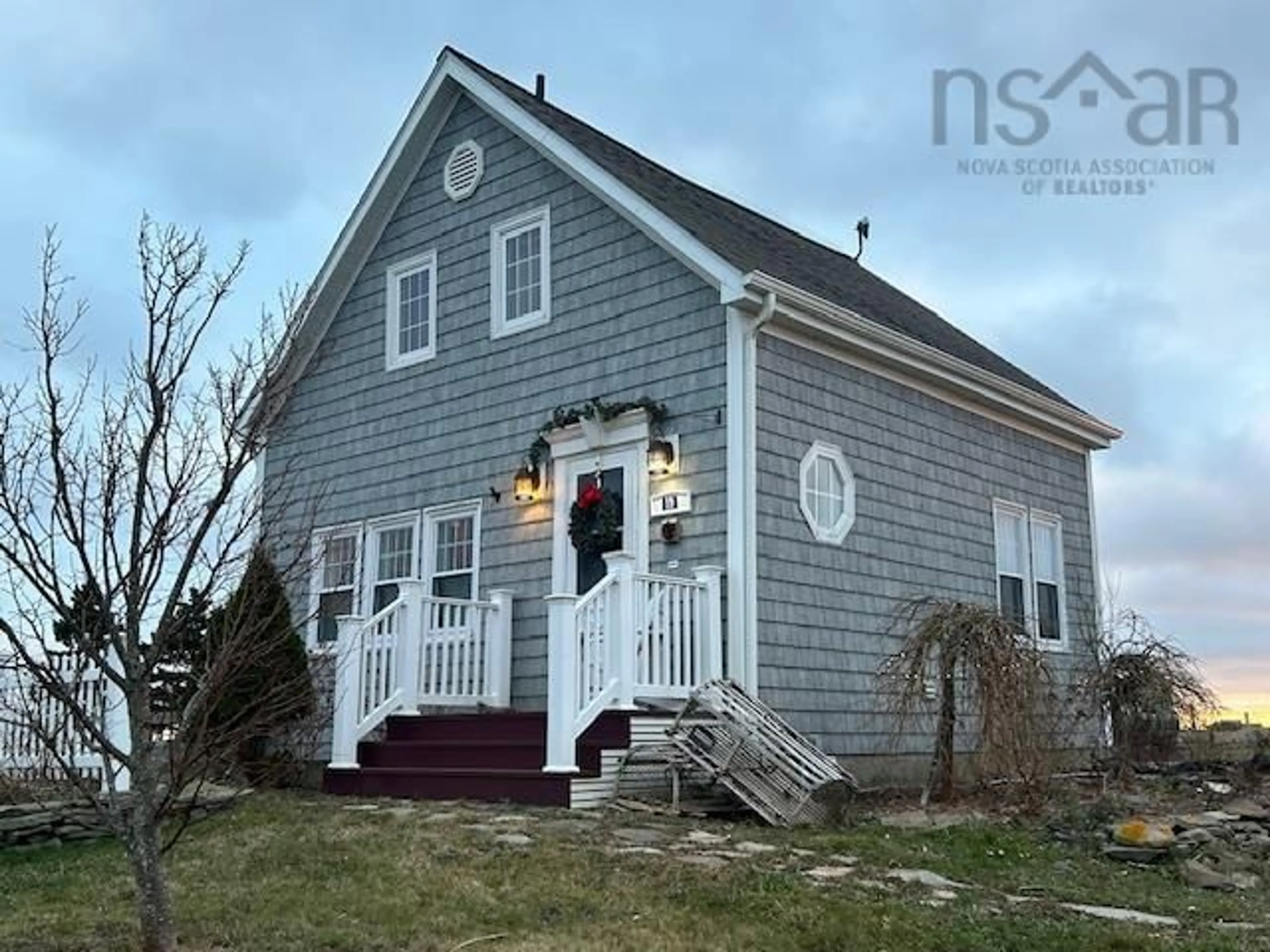 Home with vinyl exterior material, street for 19 Cove Rd, West Arichat Nova Scotia B0E 3J0