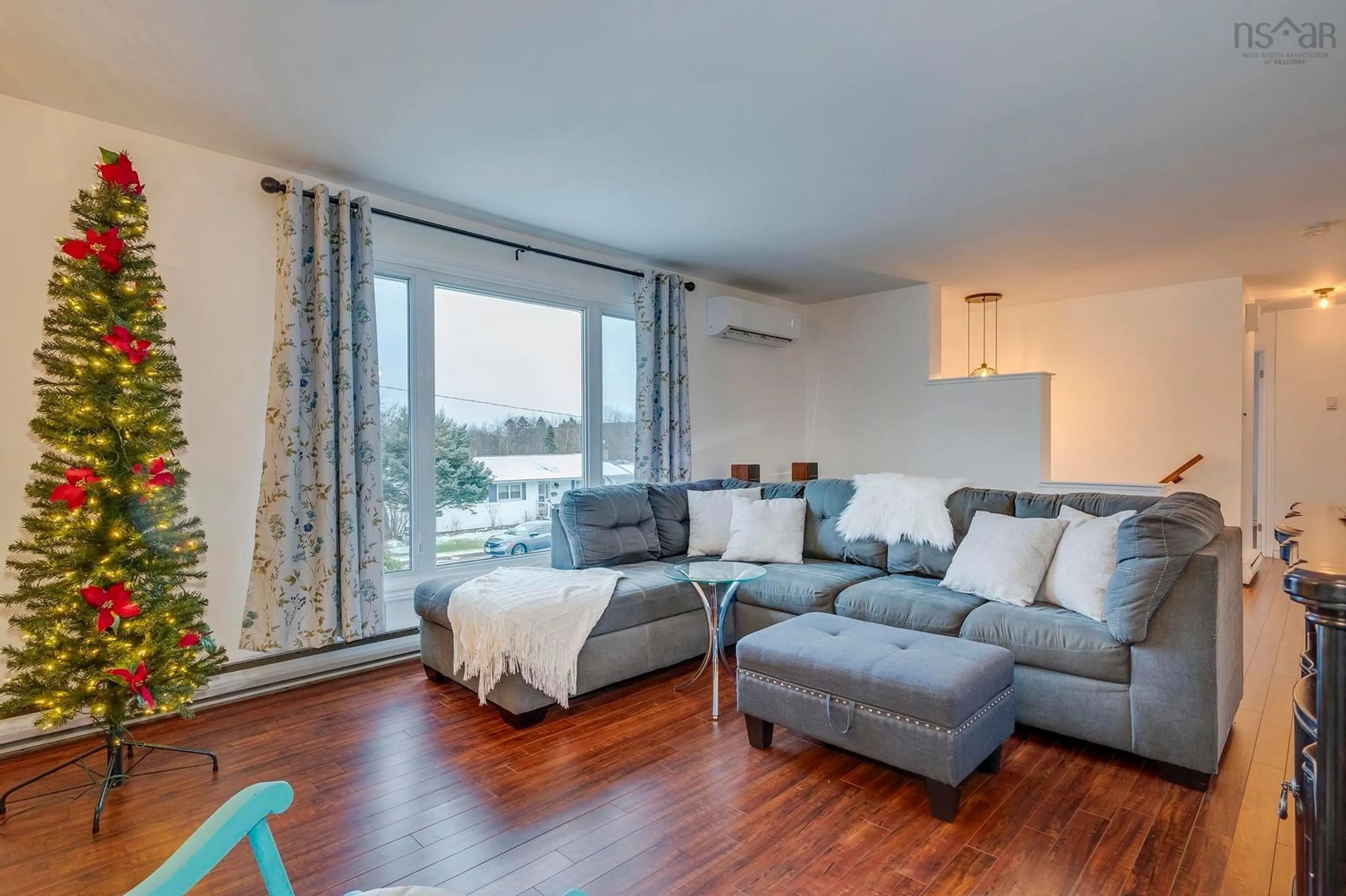 Living room with furniture, wood/laminate floor for 21 Tamarack Cir, Lower Sackville Nova Scotia B4C 1E4