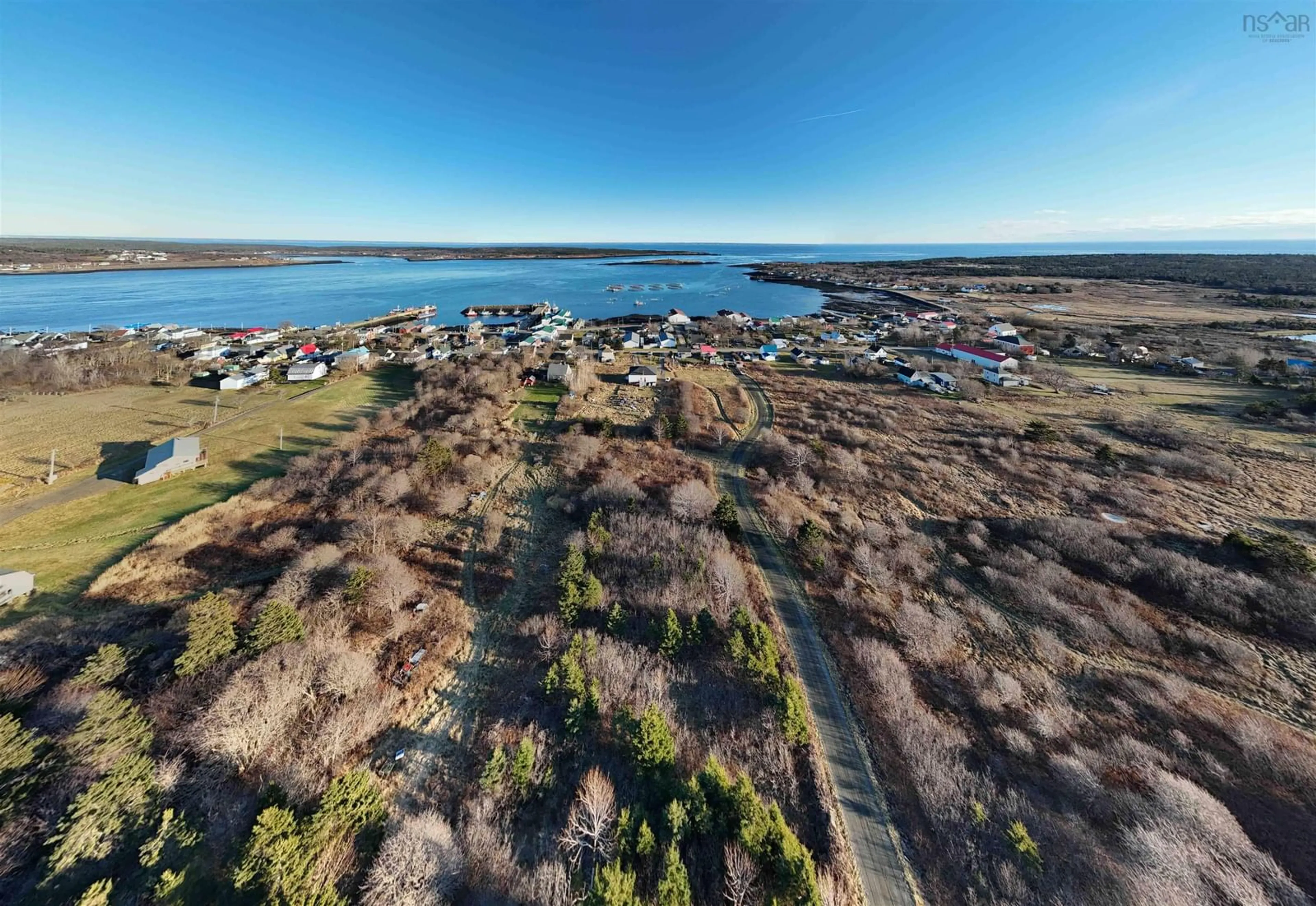 A pic from outside/outdoor area/front of a property/back of a property/a pic from drone, water/lake/river/ocean view for 63 Second Street, Westport Nova Scotia B0V 1H0