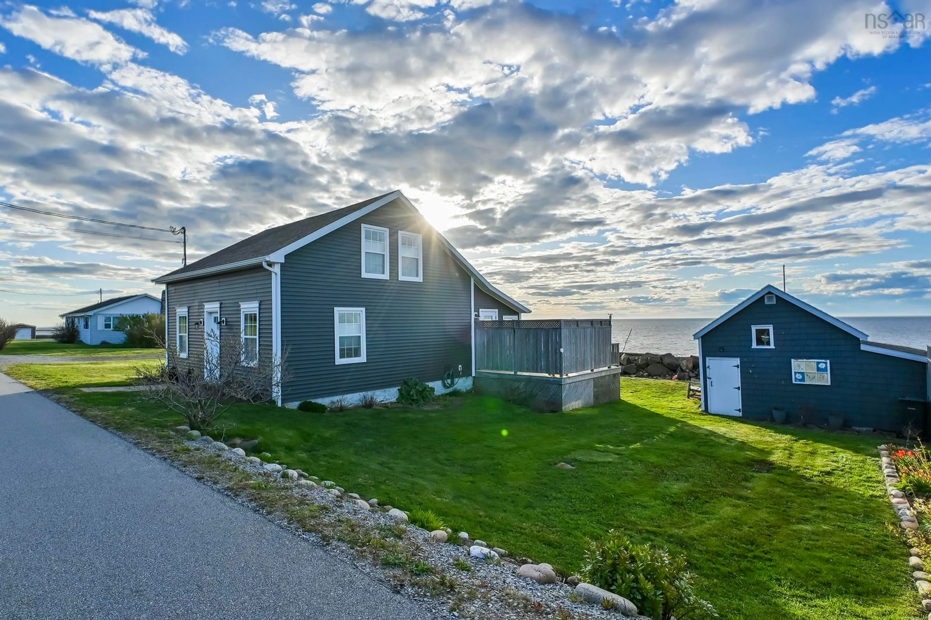 A pic from outside/outdoor area/front of a property/back of a property/a pic from drone, water/lake/river/ocean view for 12271 Shore Rd, Port George Nova Scotia B0S 1P0