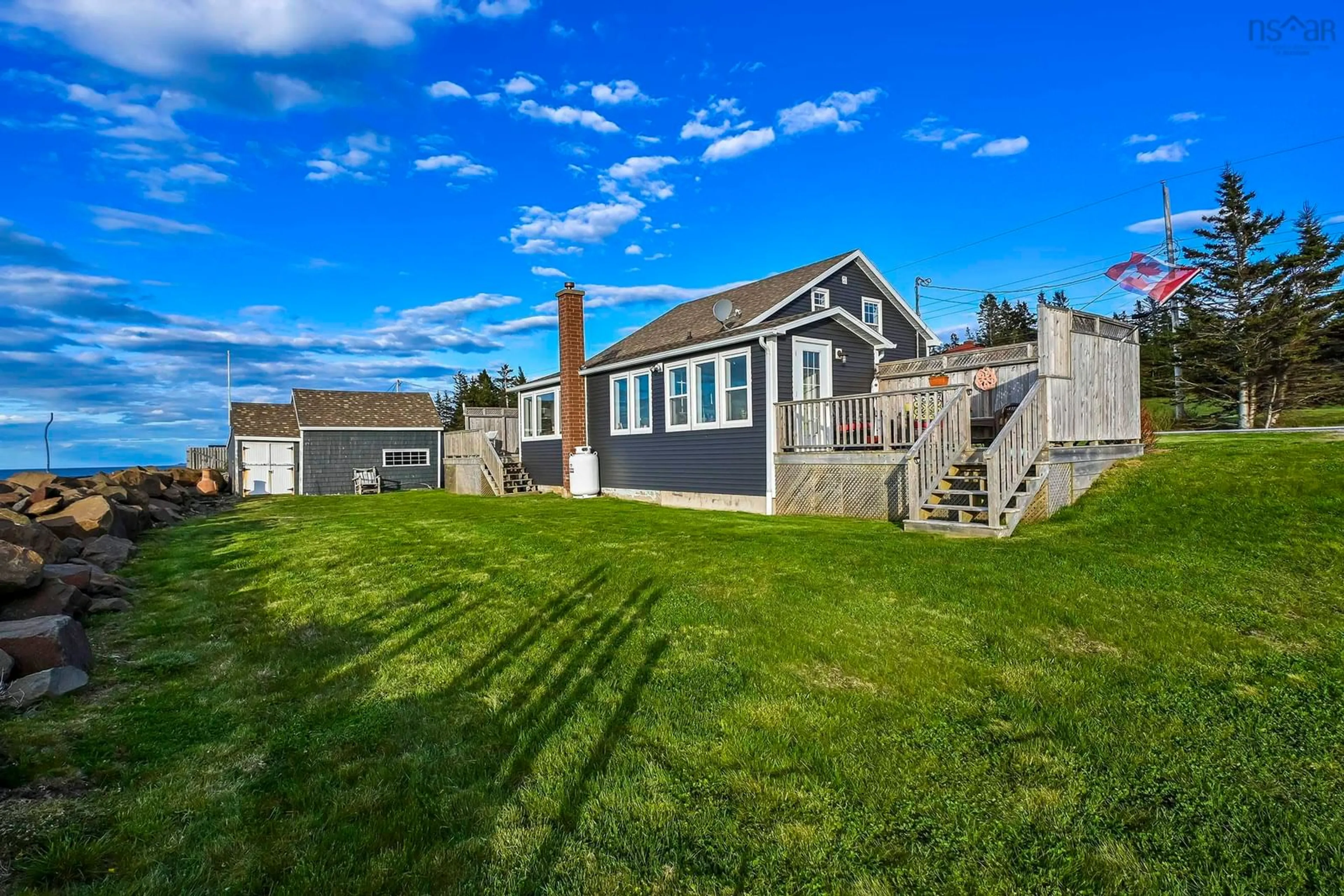 A pic from outside/outdoor area/front of a property/back of a property/a pic from drone, water/lake/river/ocean view for 12271 Shore Rd, Port George Nova Scotia B0S 1P0