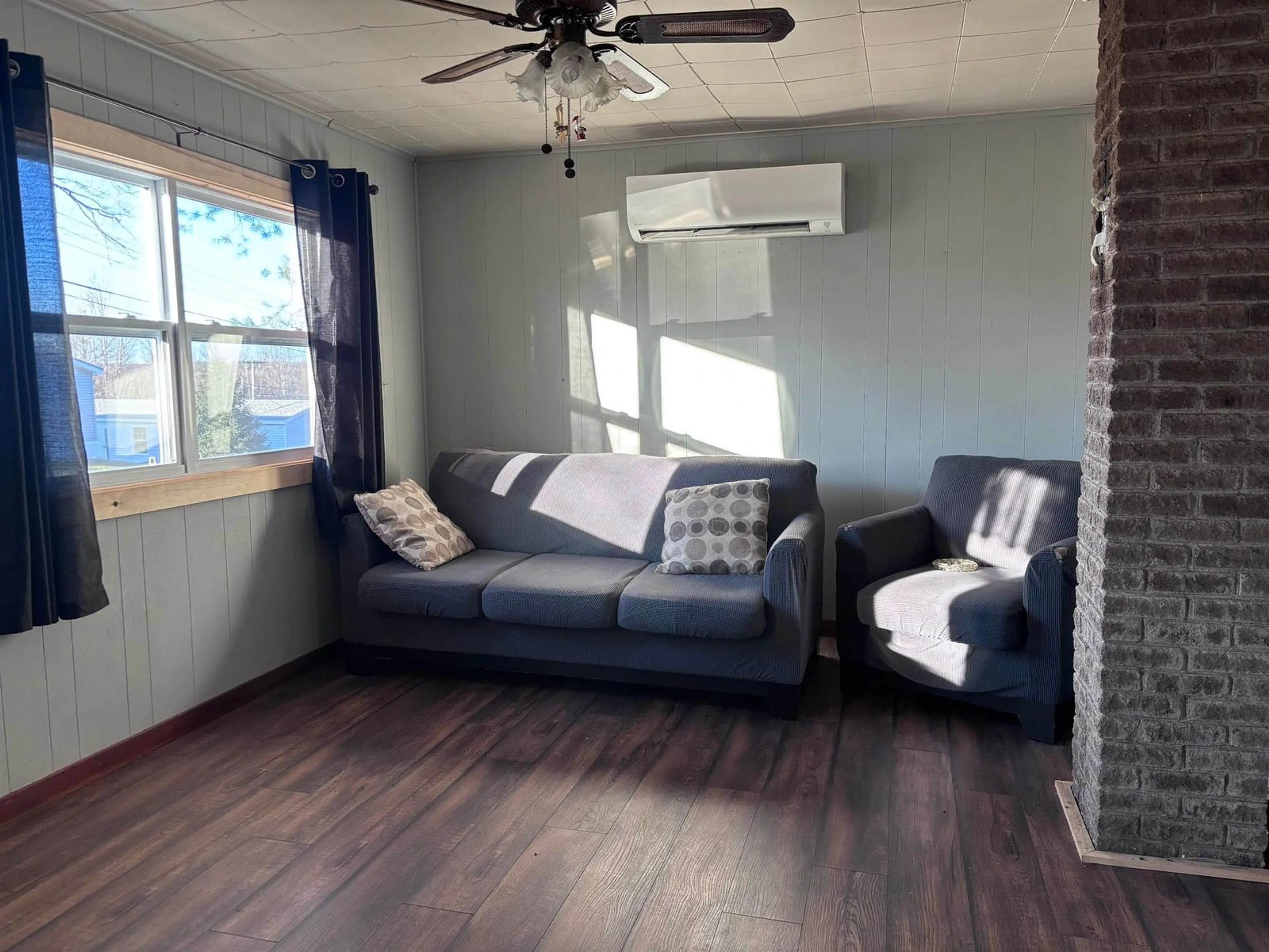 Living room with furniture, wood/laminate floor for 102 Hillside Rd, Hillside Nova Scotia B0K 1X0