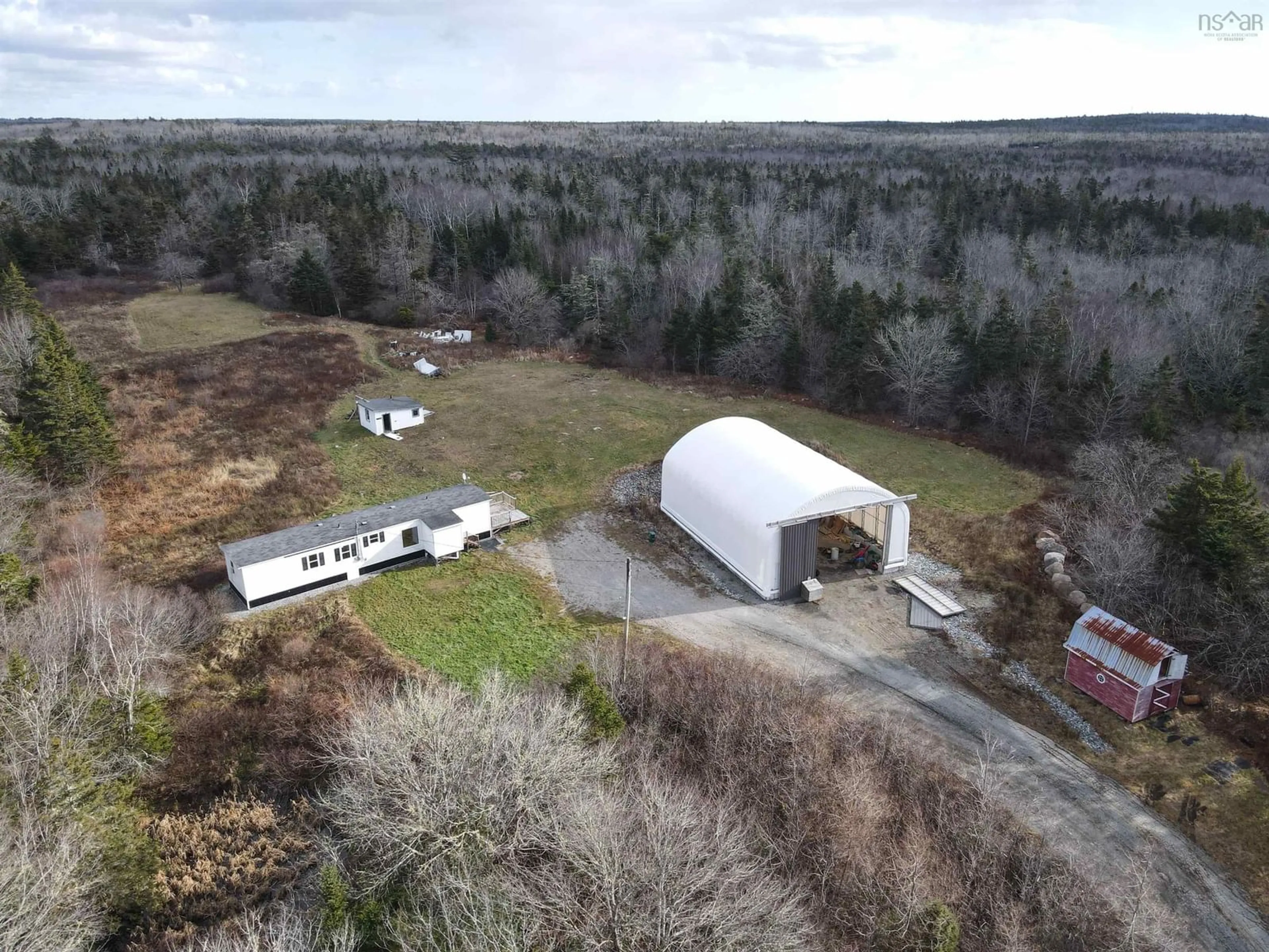 A pic from outside/outdoor area/front of a property/back of a property/a pic from drone, building for 1863 Sandy Point Rd, Sandy Point Nova Scotia B0T 1W0