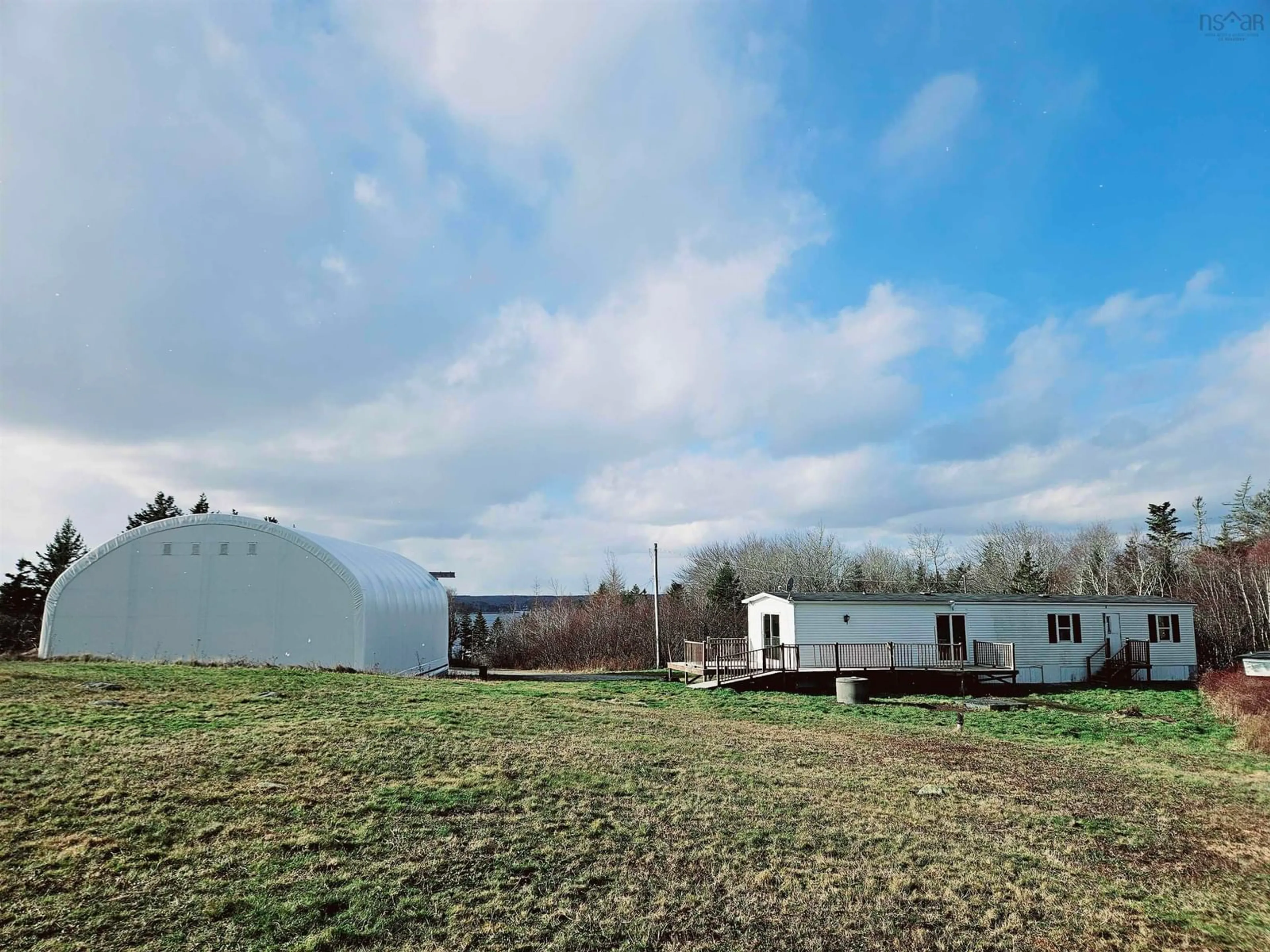 A pic from outside/outdoor area/front of a property/back of a property/a pic from drone, building for 1863 Sandy Point Rd, Sandy Point Nova Scotia B0T 1W0