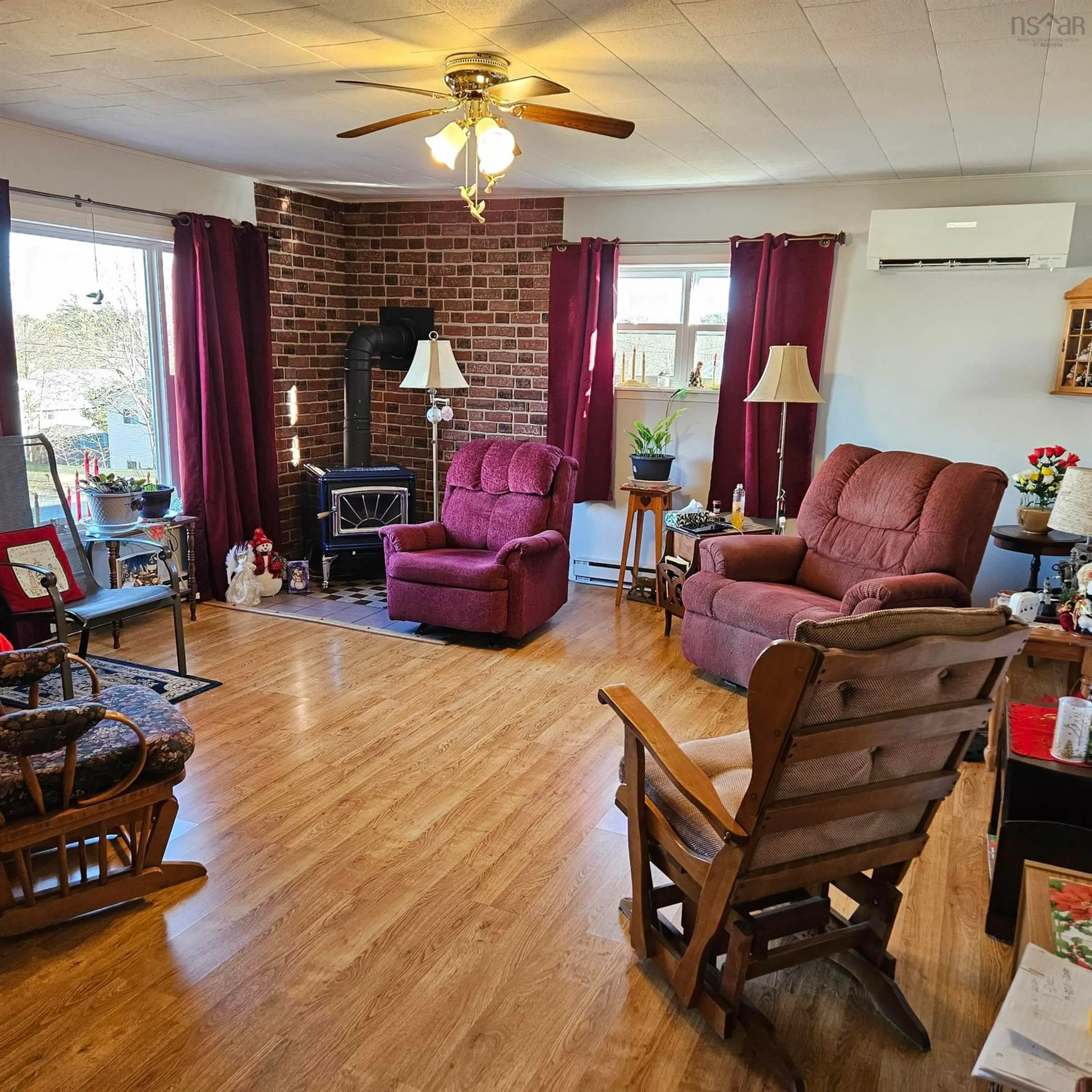 Living room with furniture, wood/laminate floor for 38 Elizabeth Ave, Bridgewater Nova Scotia B4V 1M2