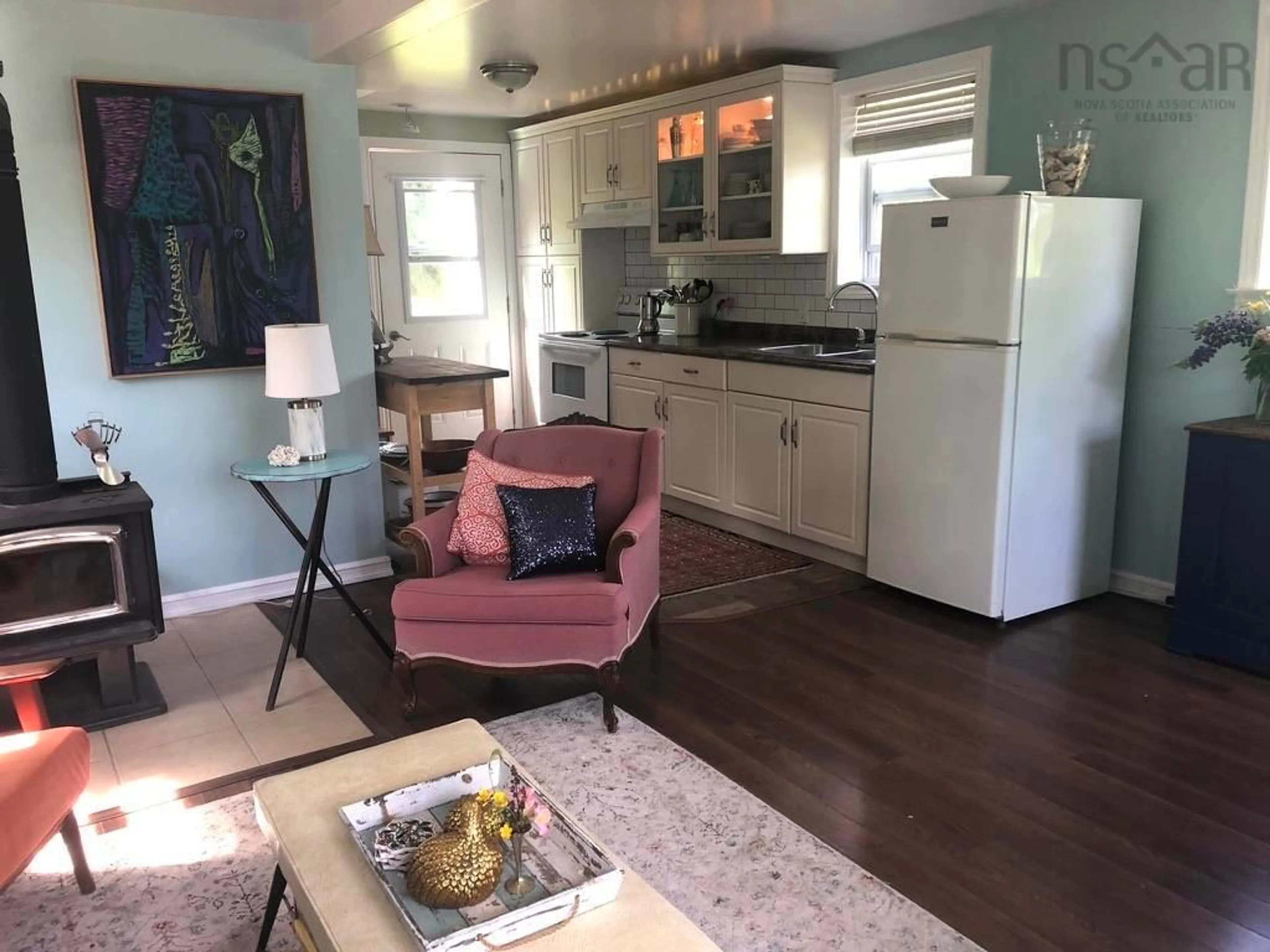 Living room with furniture, wood/laminate floor for 3577 Malagash Rd, Malagash Centre Nova Scotia B0K 1E0