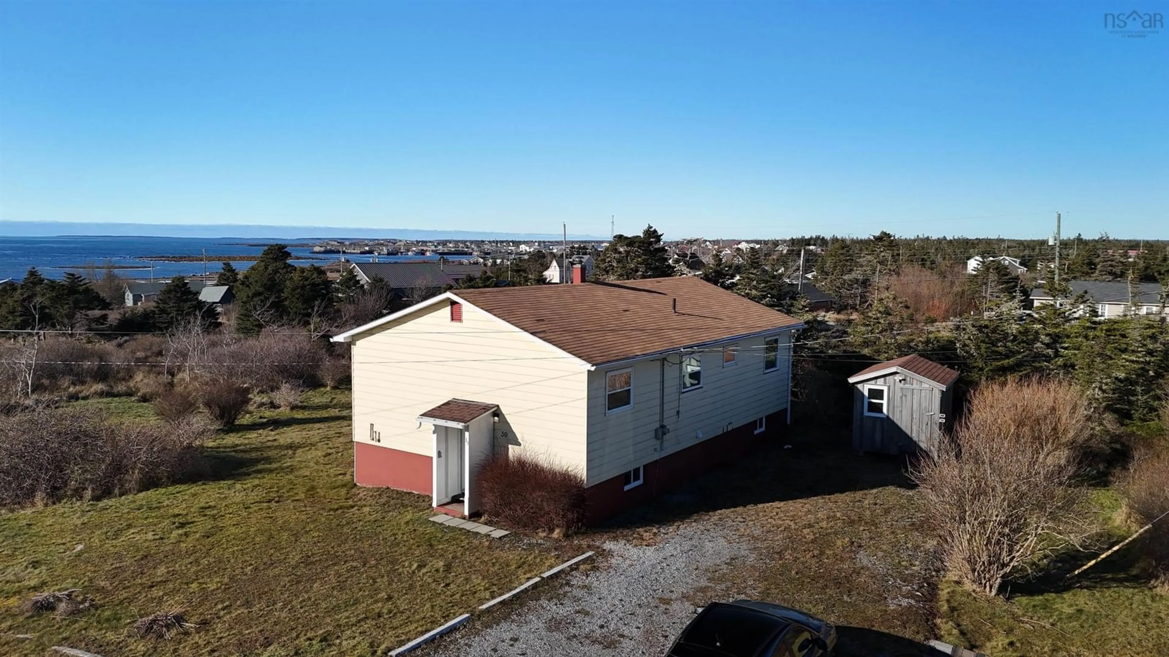 A pic from outside/outdoor area/front of a property/back of a property/a pic from drone, unknown for 39 Robie St, Clark's Harbour Nova Scotia B0W 1P0