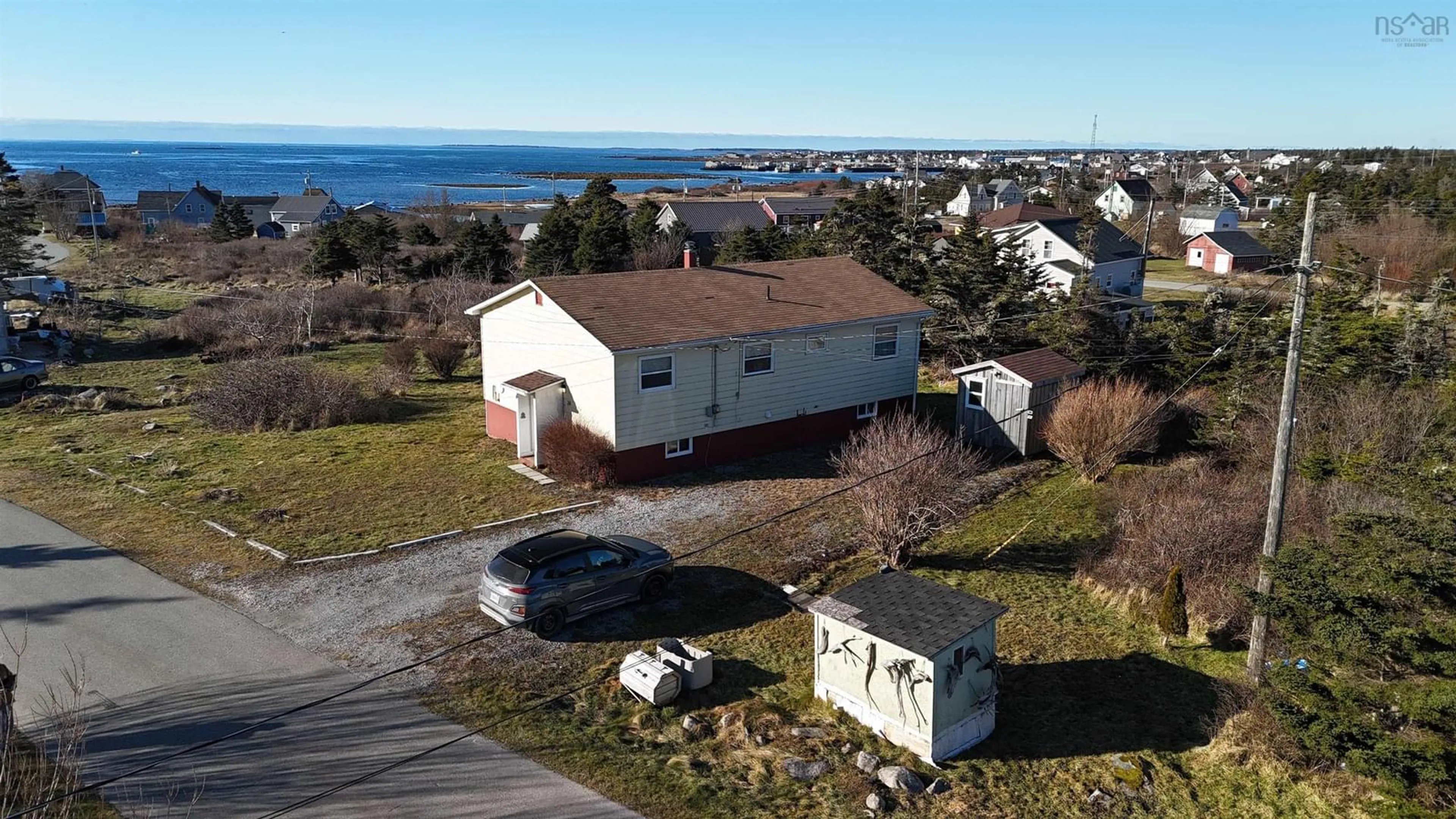 A pic from outside/outdoor area/front of a property/back of a property/a pic from drone, water/lake/river/ocean view for 39 Robie St, Clark's Harbour Nova Scotia B0W 1P0