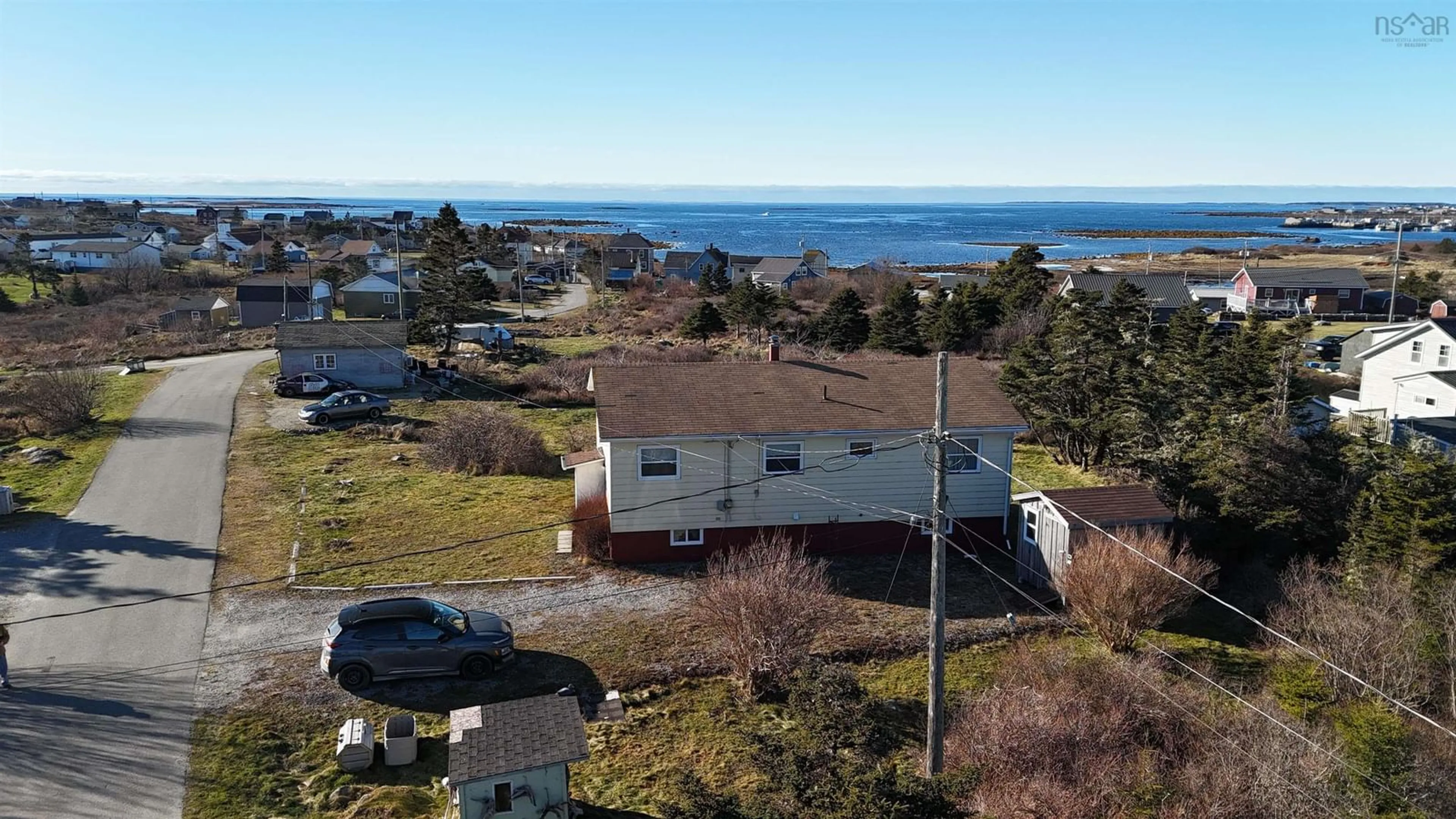 A pic from outside/outdoor area/front of a property/back of a property/a pic from drone, water/lake/river/ocean view for 39 Robie St, Clark's Harbour Nova Scotia B0W 1P0