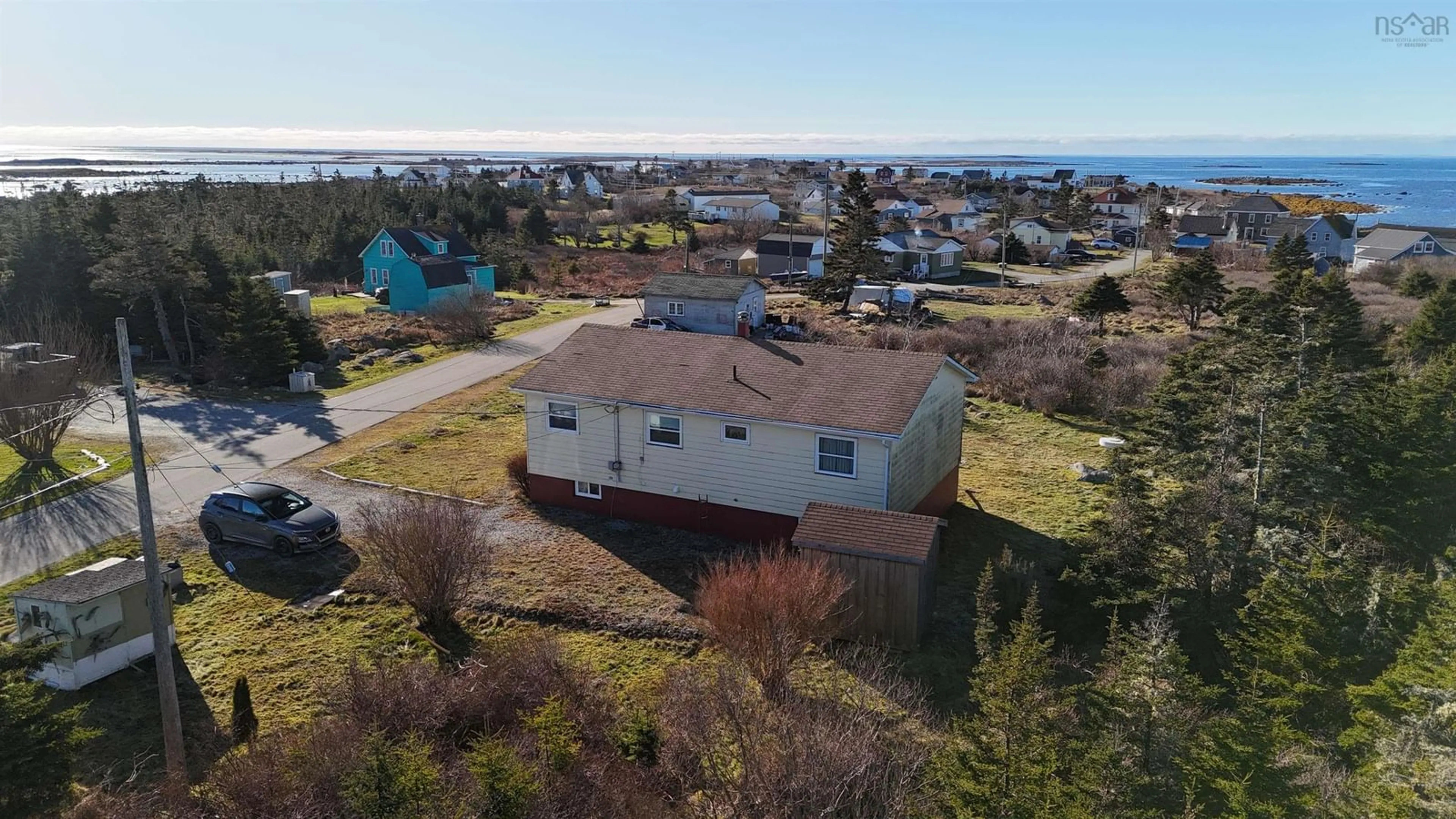 A pic from outside/outdoor area/front of a property/back of a property/a pic from drone, water/lake/river/ocean view for 39 Robie St, Clark's Harbour Nova Scotia B0W 1P0