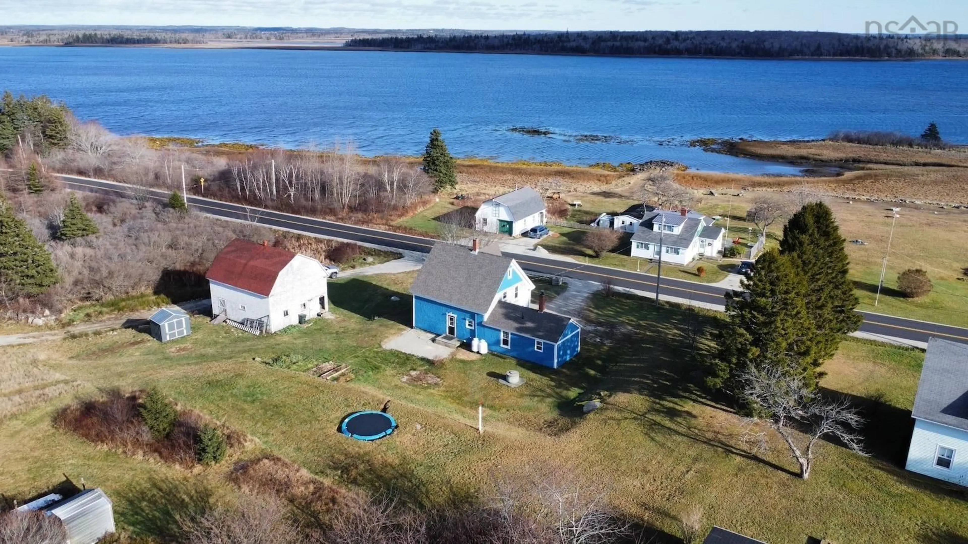 A pic from outside/outdoor area/front of a property/back of a property/a pic from drone, water/lake/river/ocean view for 310 Chemin Des Bouleaux, Sluice Point Nova Scotia B0W 3M0