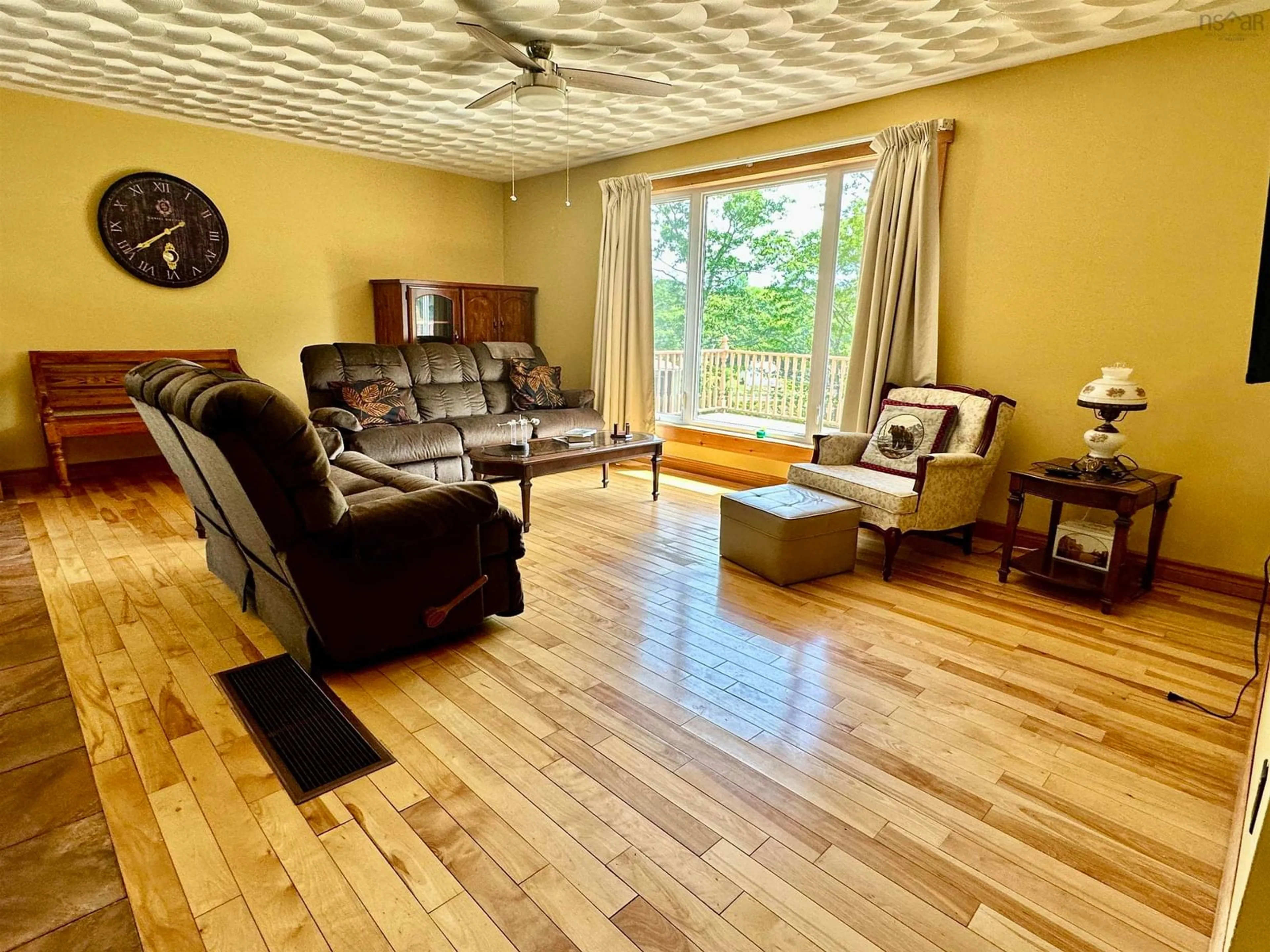 Living room with furniture, wood/laminate floor for 75 Tupper St, Milton Nova Scotia B0T 1P0