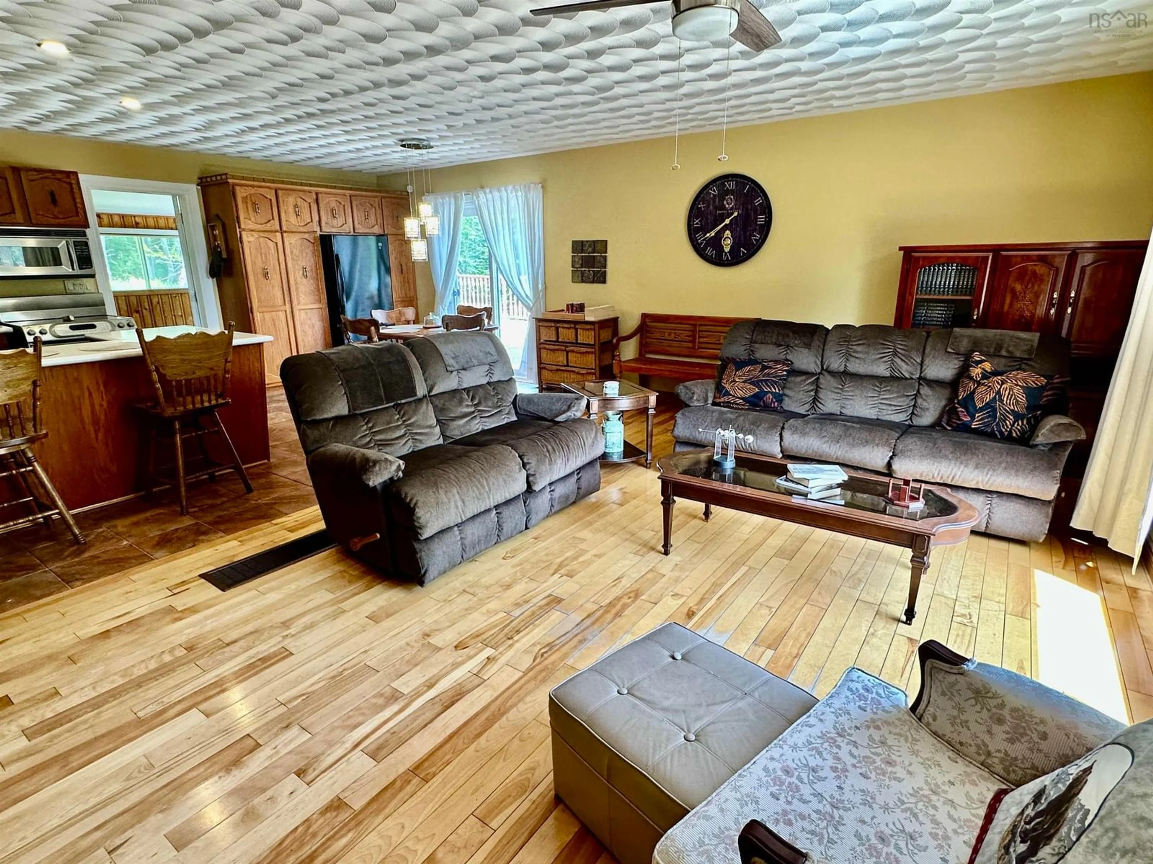 Living room with furniture, wood/laminate floor for 75 Tupper St, Milton Nova Scotia B0T 1P0