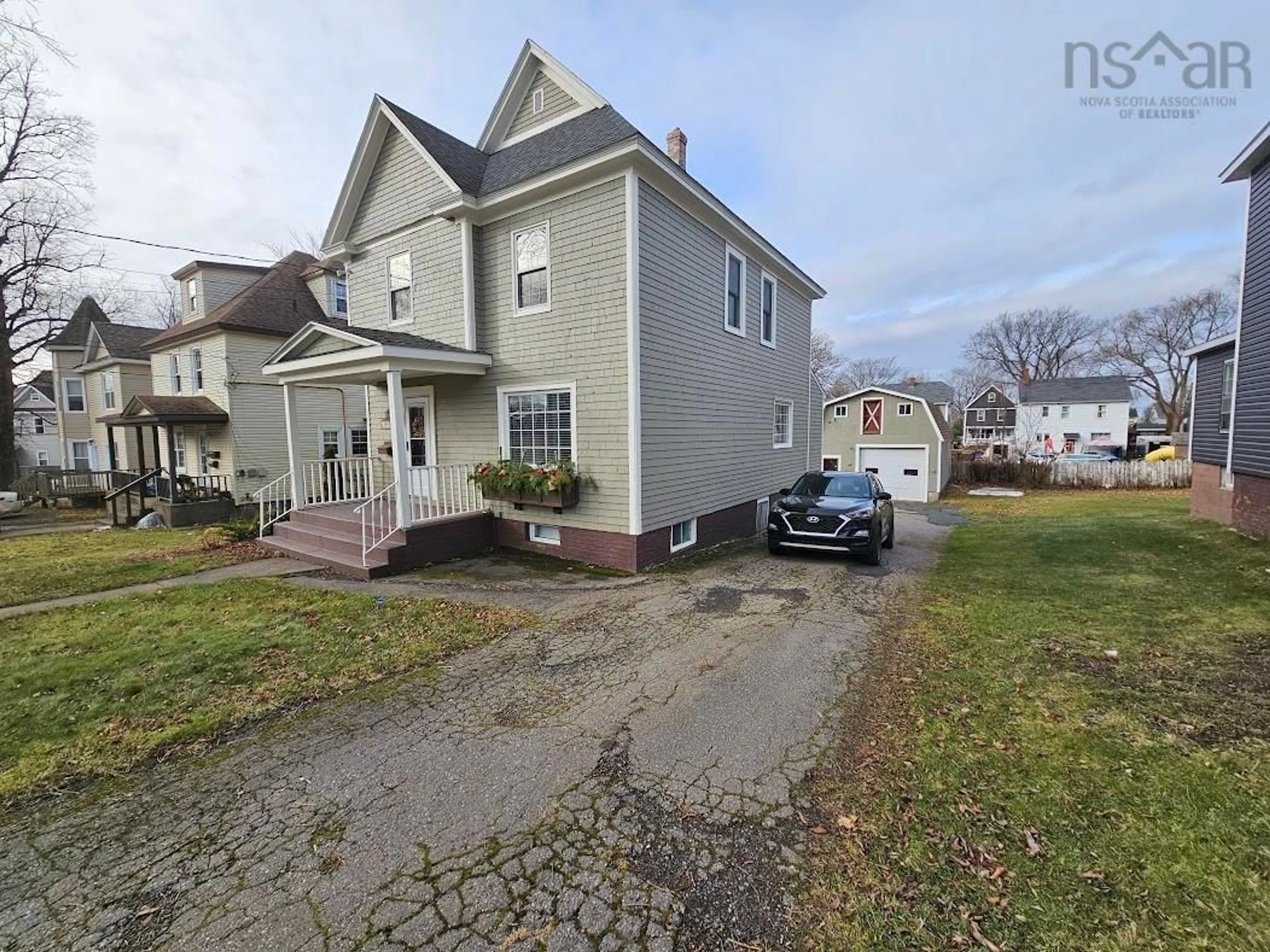 A pic from outside/outdoor area/front of a property/back of a property/a pic from drone, street for 159 Whitney Ave, Sydney Nova Scotia B1P 1K9