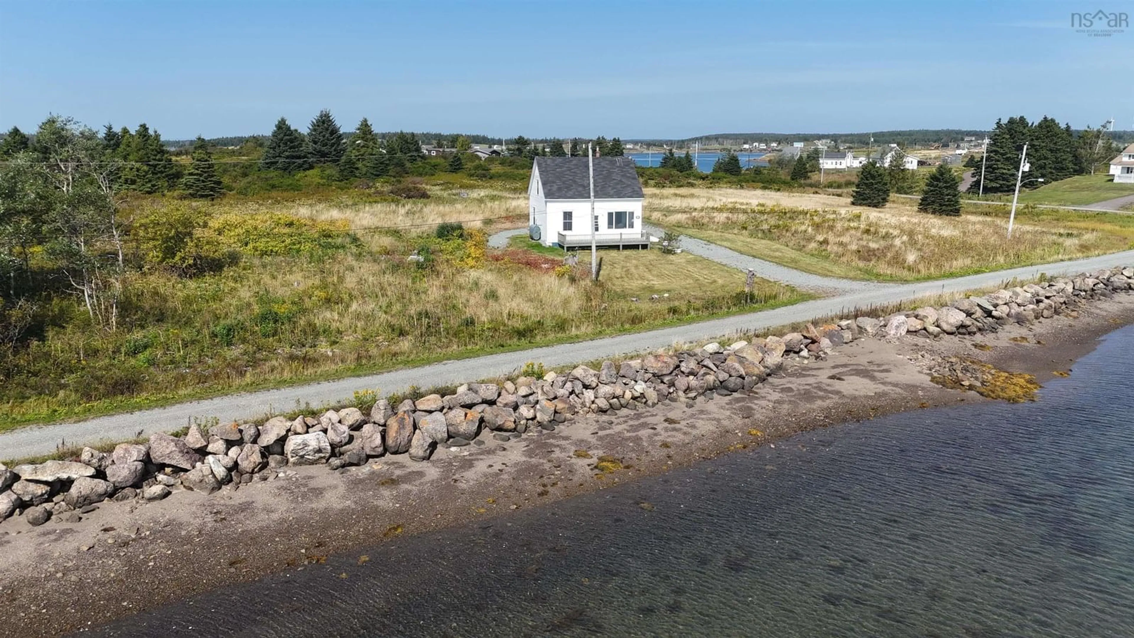 A pic from outside/outdoor area/front of a property/back of a property/a pic from drone, water/lake/river/ocean view for 20 Meunier Lane, West Arichat Nova Scotia B0E 3J0