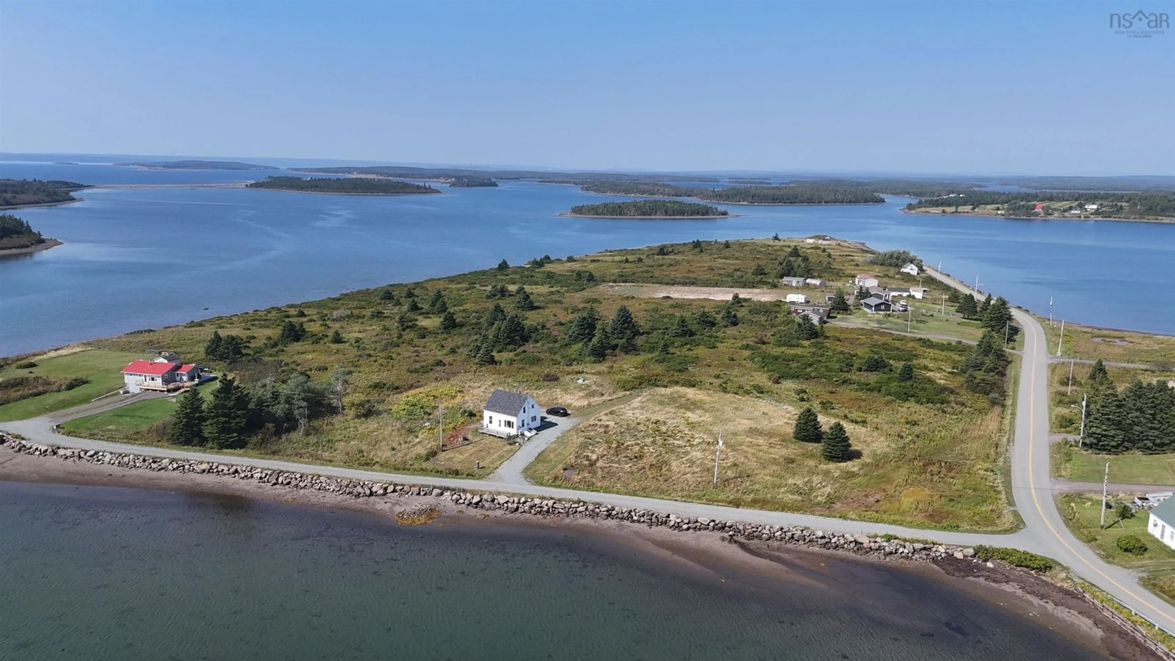 A pic from outside/outdoor area/front of a property/back of a property/a pic from drone, water/lake/river/ocean view for 20 Meunier Lane, West Arichat Nova Scotia B0E 3J0