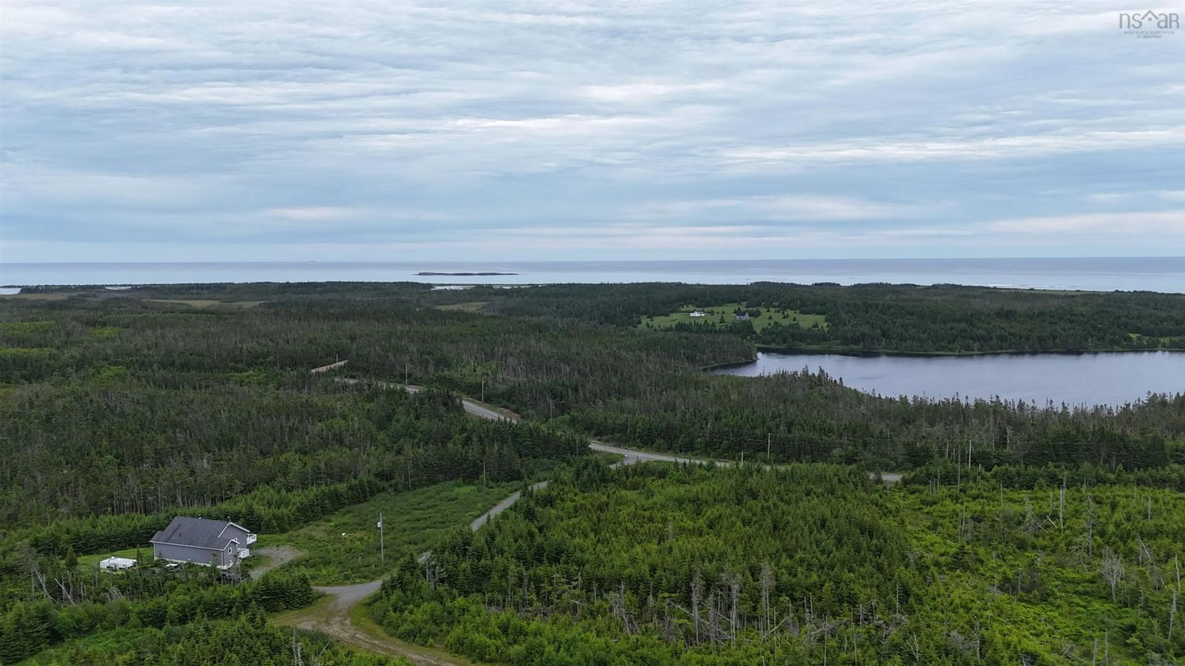 A pic from outside/outdoor area/front of a property/back of a property/a pic from drone, water/lake/river/ocean view for 4381 St. Peter's Fourchu Rd, Grand River Nova Scotia B0E 1M0