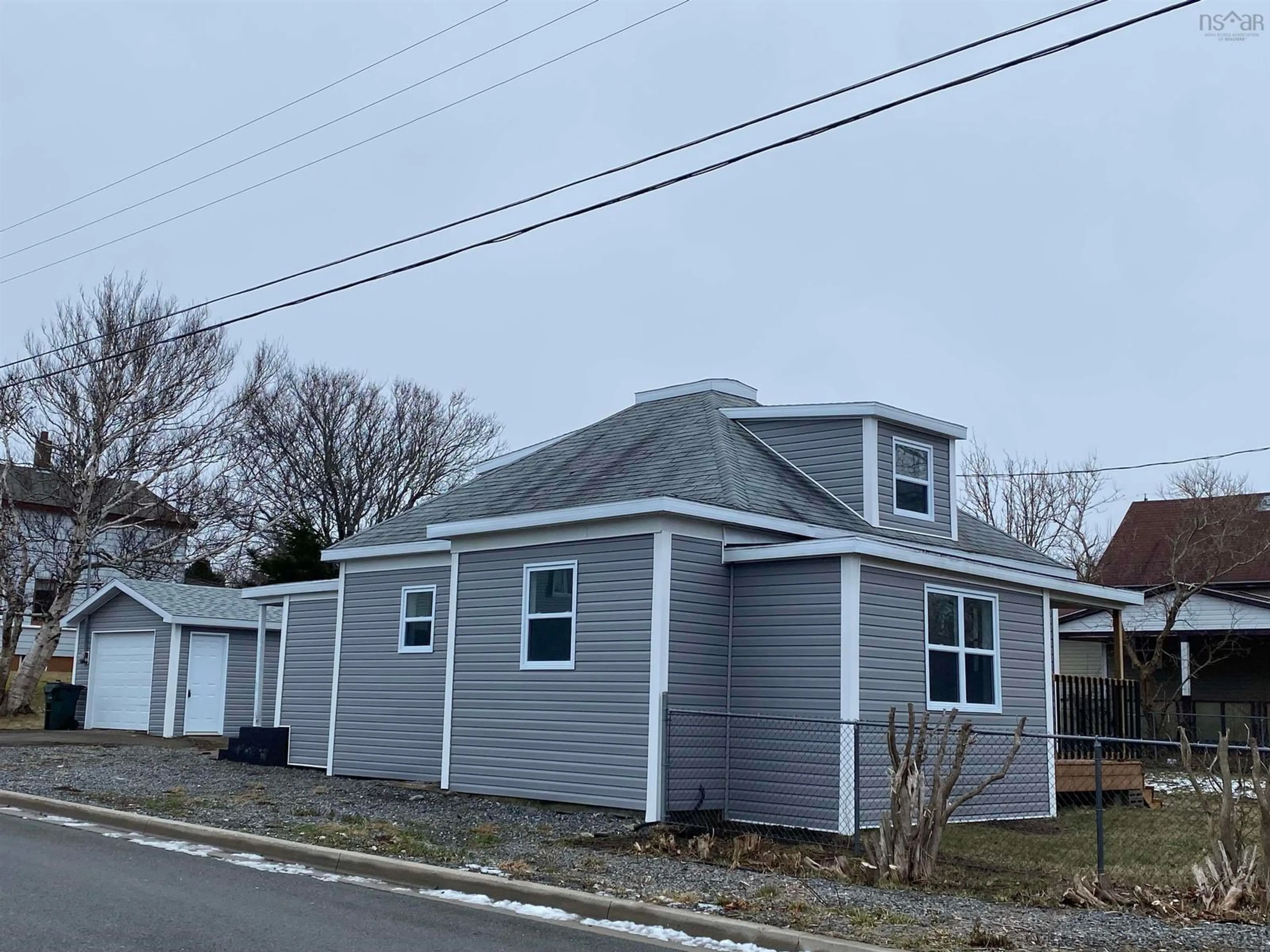 A pic from outside/outdoor area/front of a property/back of a property/a pic from drone, street for 310 Mahon St, New Waterford Nova Scotia B1H 3H3