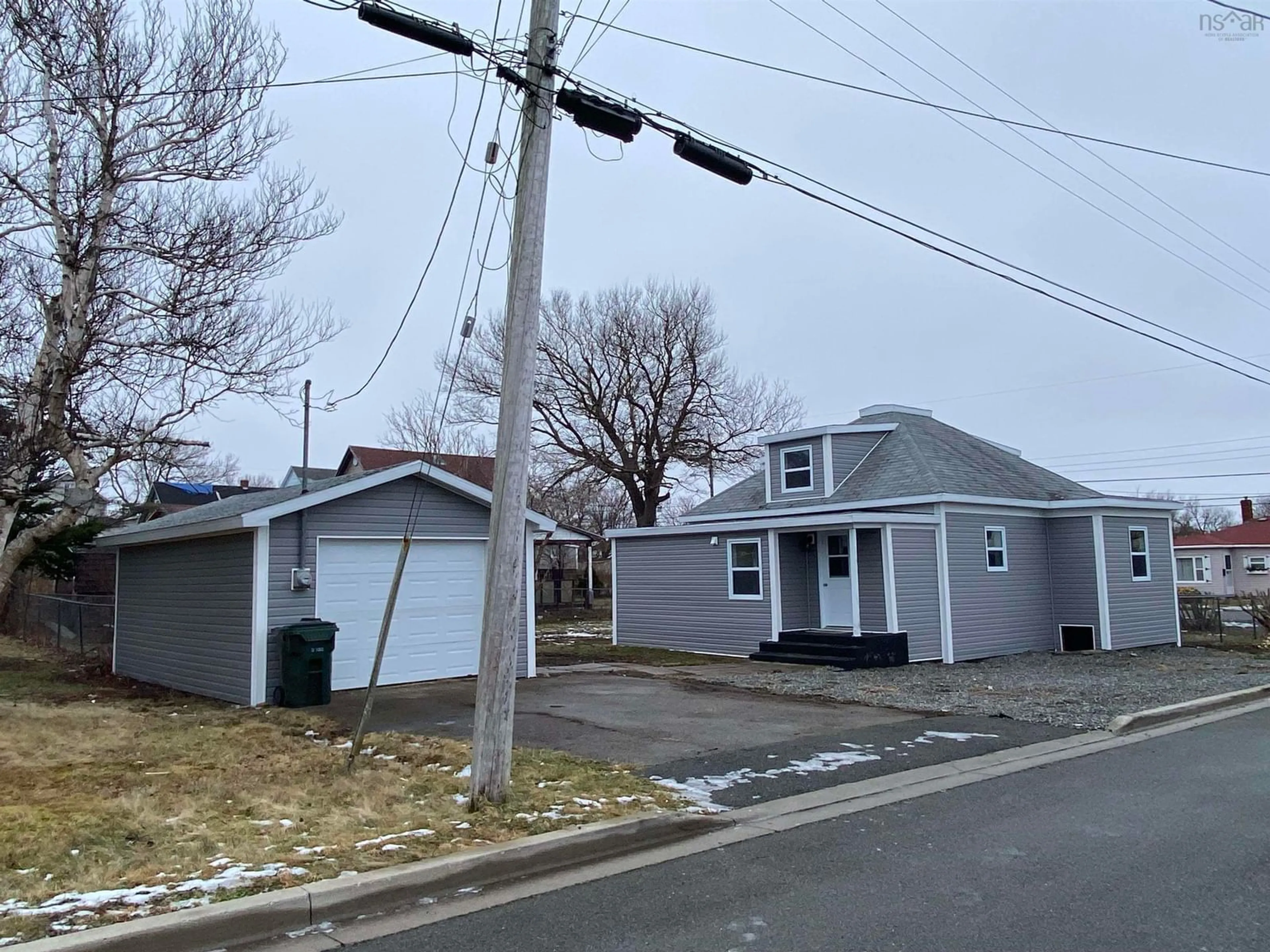 A pic from outside/outdoor area/front of a property/back of a property/a pic from drone, street for 310 Mahon St, New Waterford Nova Scotia B1H 3H3