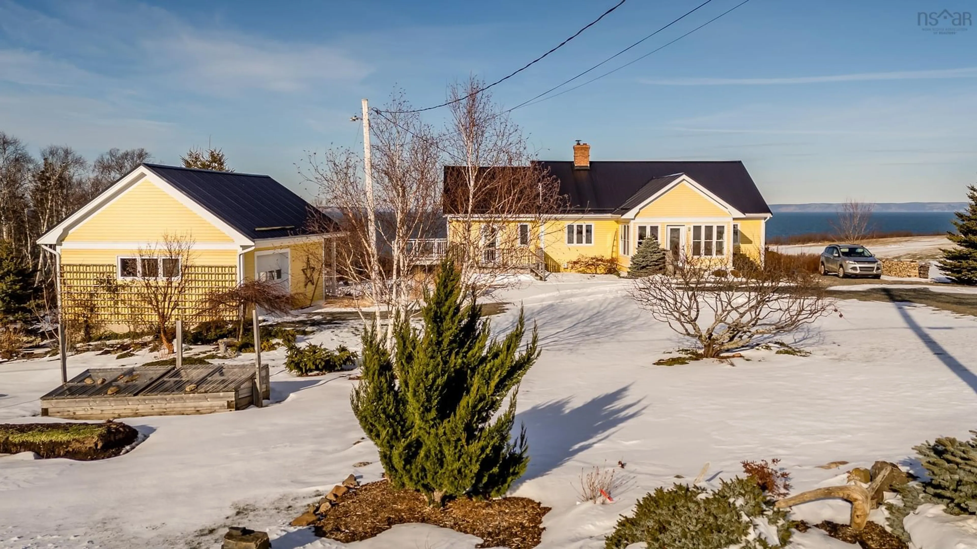 A pic from outside/outdoor area/front of a property/back of a property/a pic from drone, street for 416 Shore Rd, Ogilvie Nova Scotia B0P 1E0