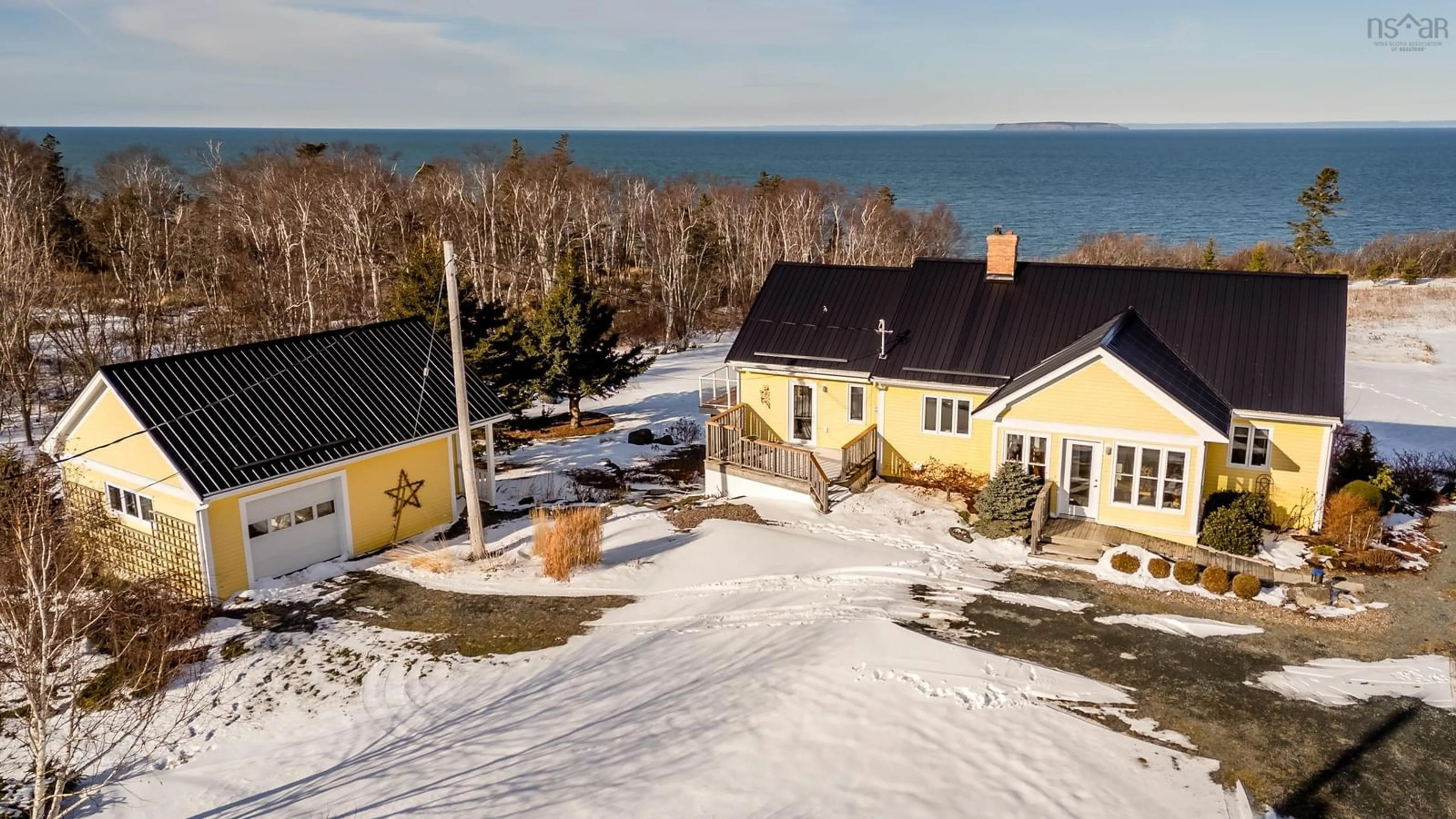 A pic from outside/outdoor area/front of a property/back of a property/a pic from drone, water/lake/river/ocean view for 416 Shore Rd, Ogilvie Nova Scotia B0P 1E0