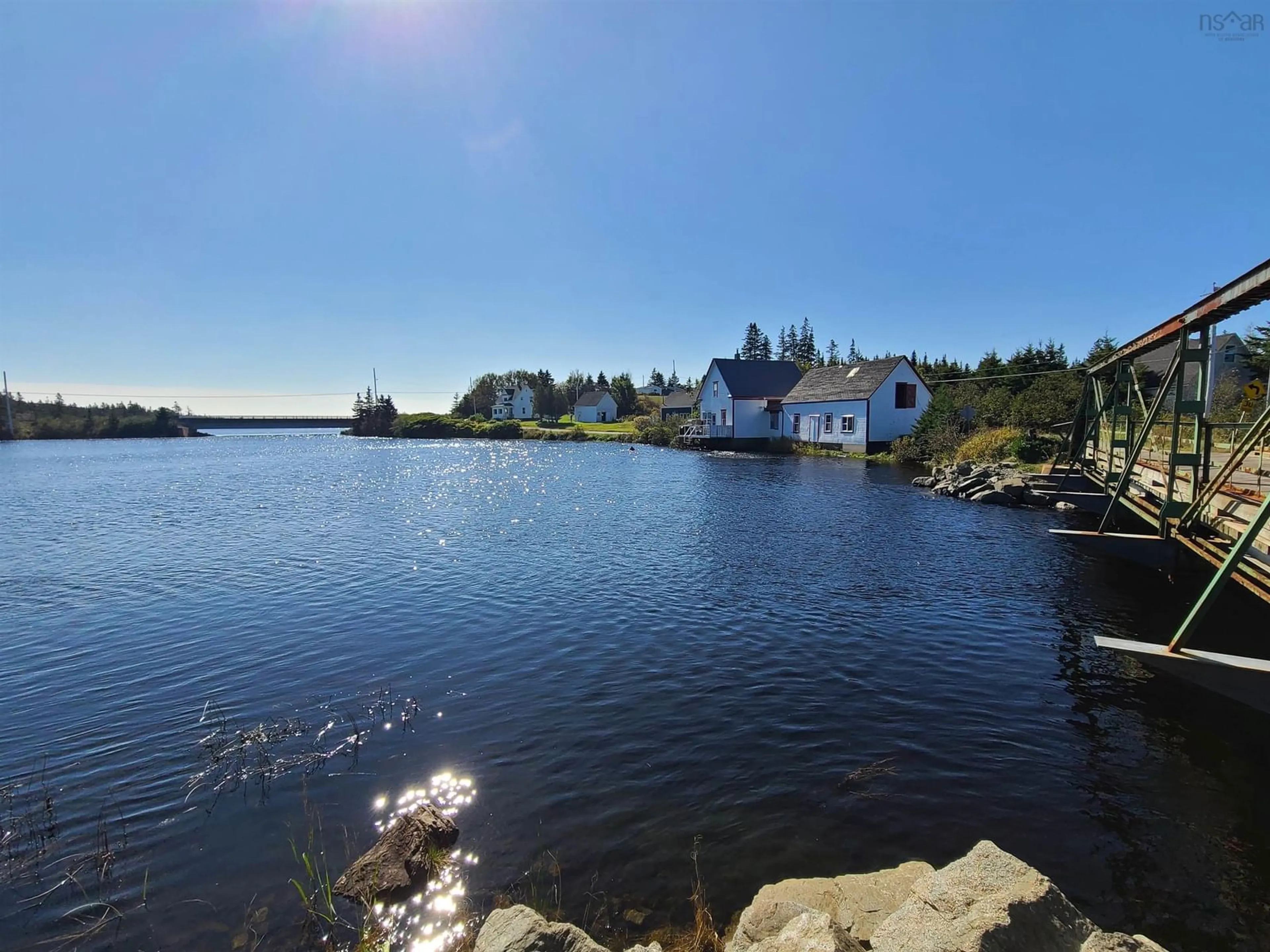 A pic from outside/outdoor area/front of a property/back of a property/a pic from drone, water/lake/river/ocean view for 1907 Soldiers Cove Road, Grand River Nova Scotia B0E 1M0