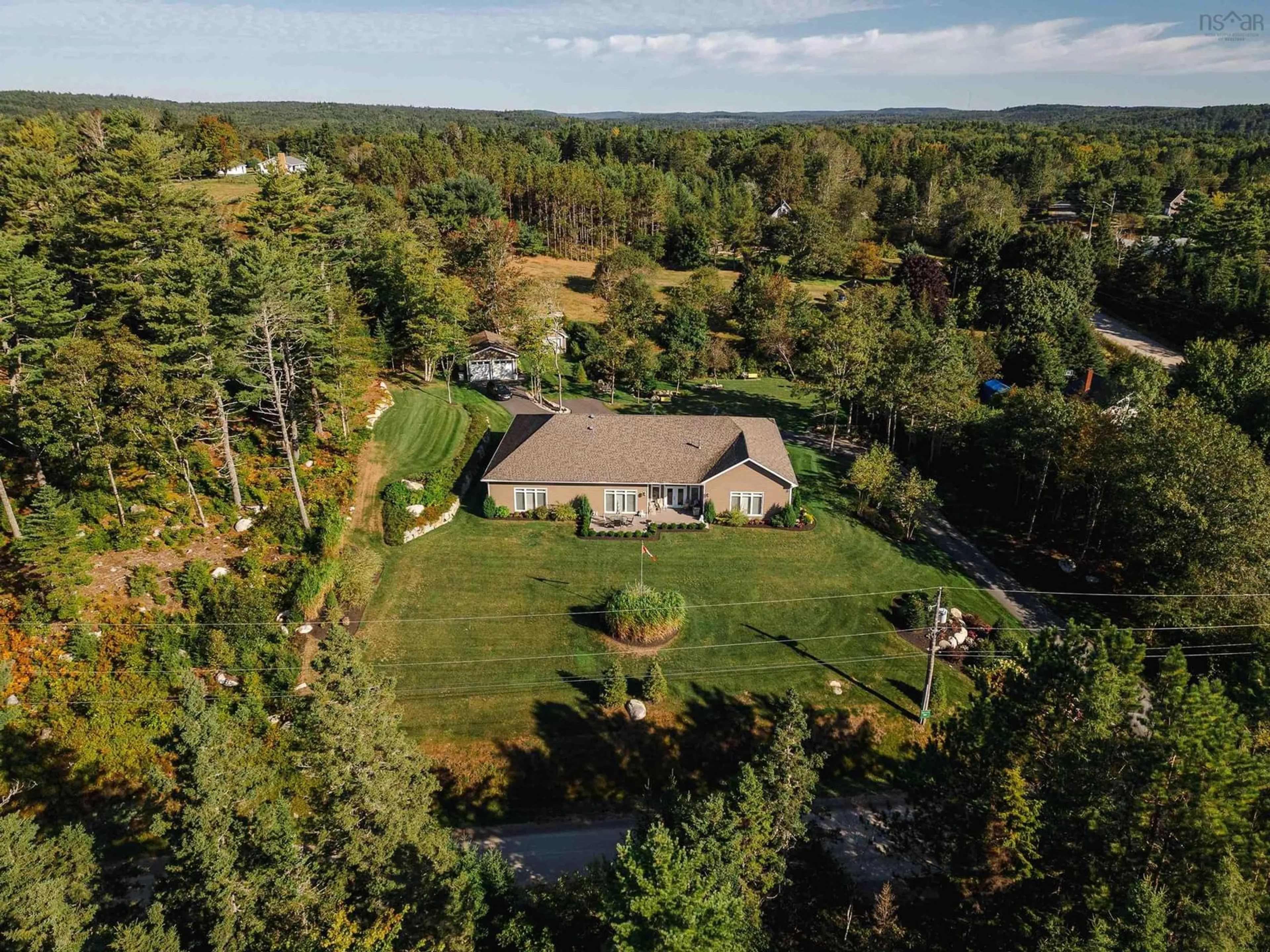 A pic from outside/outdoor area/front of a property/back of a property/a pic from drone, forest/trees view for 10 Swallow Point Rd, Chester Basin Nova Scotia B0J 1K0