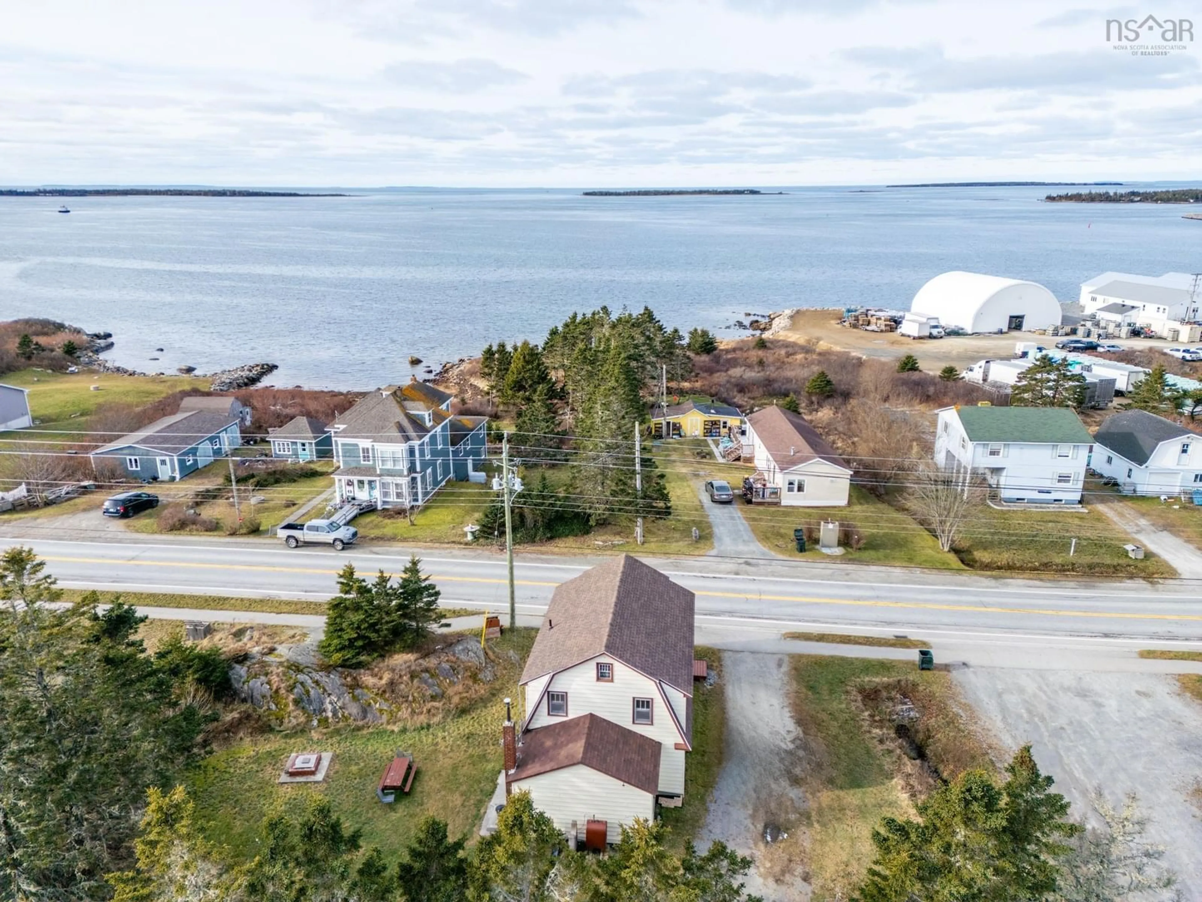 A pic from outside/outdoor area/front of a property/back of a property/a pic from drone, water/lake/river/ocean view for 6622 Highway 3, Lower Woods Harbour Nova Scotia B0W 2E0