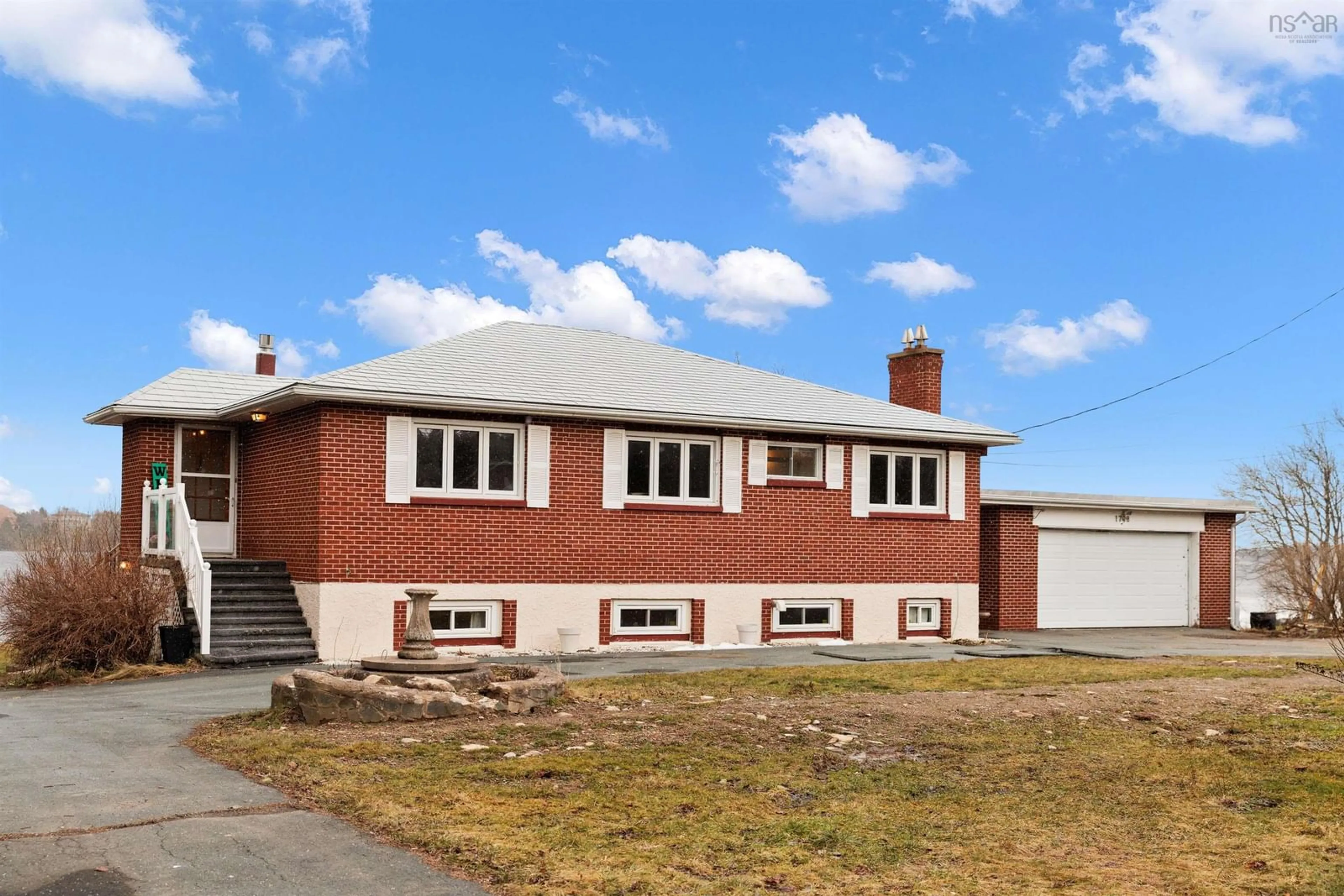 Home with brick exterior material, building for 1748 Crowell Rd, East Lawrencetown Nova Scotia B2Z 1N7