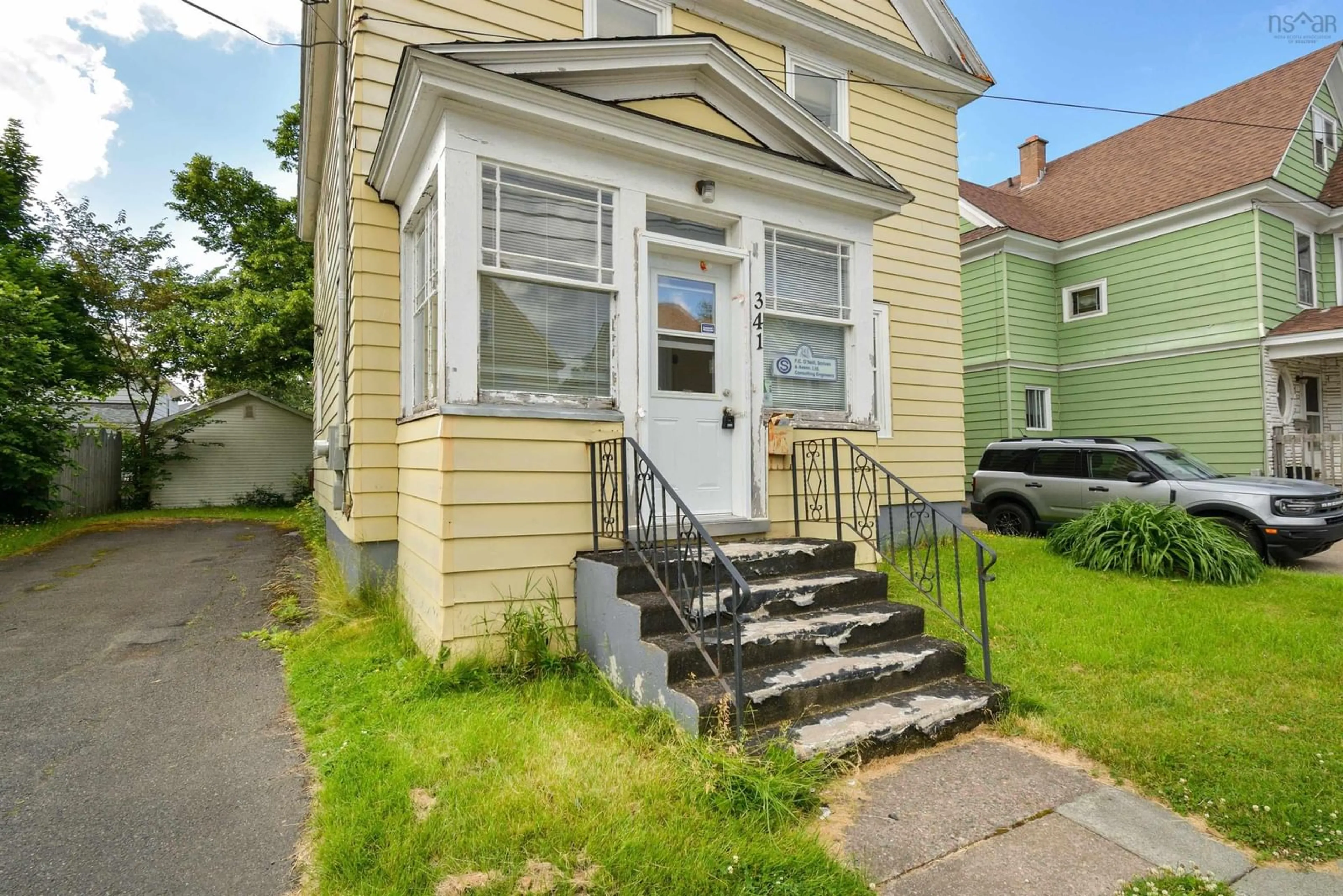 Home with vinyl exterior material, street for 341 Townsend St, Sydney Nova Scotia B1P 5G1