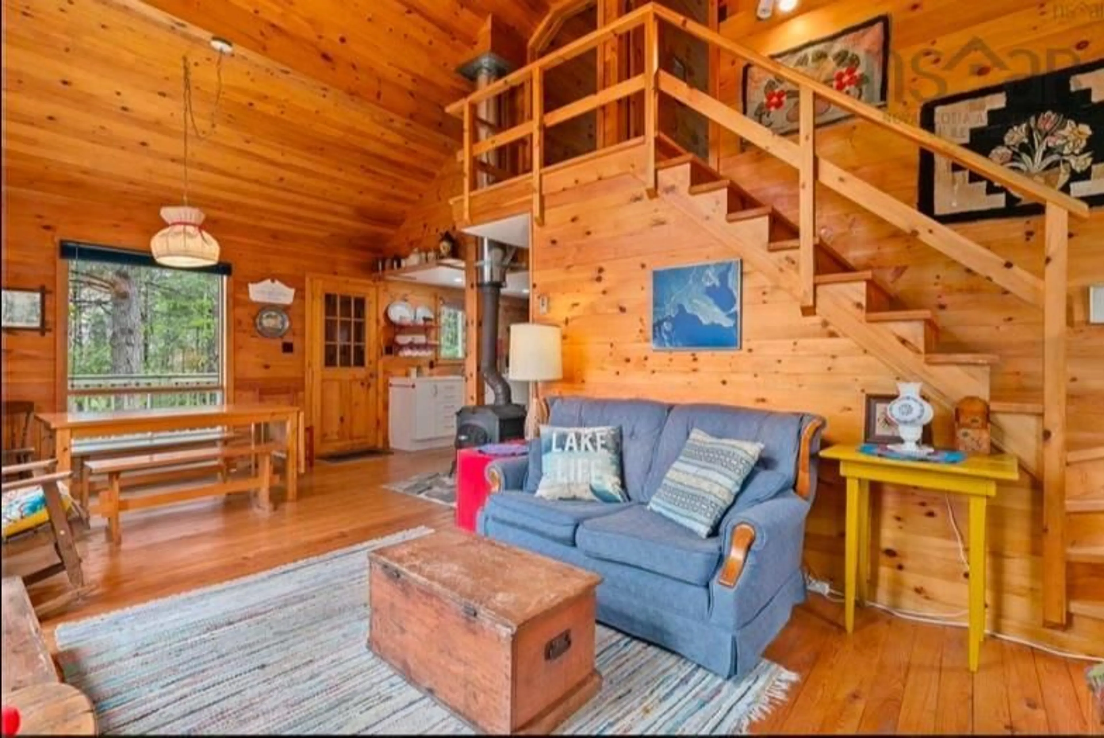 Living room with furniture, wood/laminate floor for 442 Narrows Rd, Labelle Nova Scotia B0T 1E0