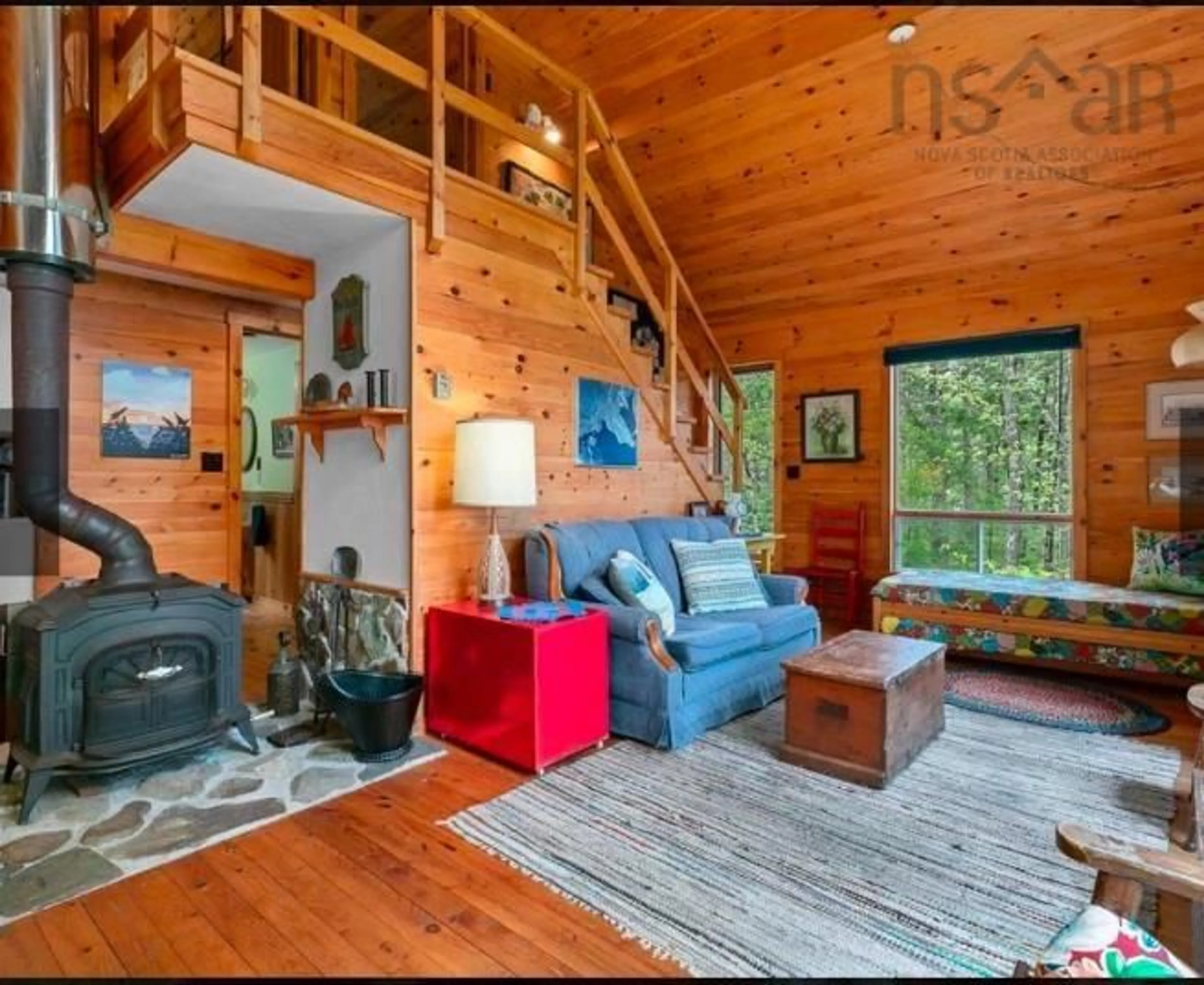 Living room with furniture, wood/laminate floor for 442 Narrows Rd, Labelle Nova Scotia B0T 1E0